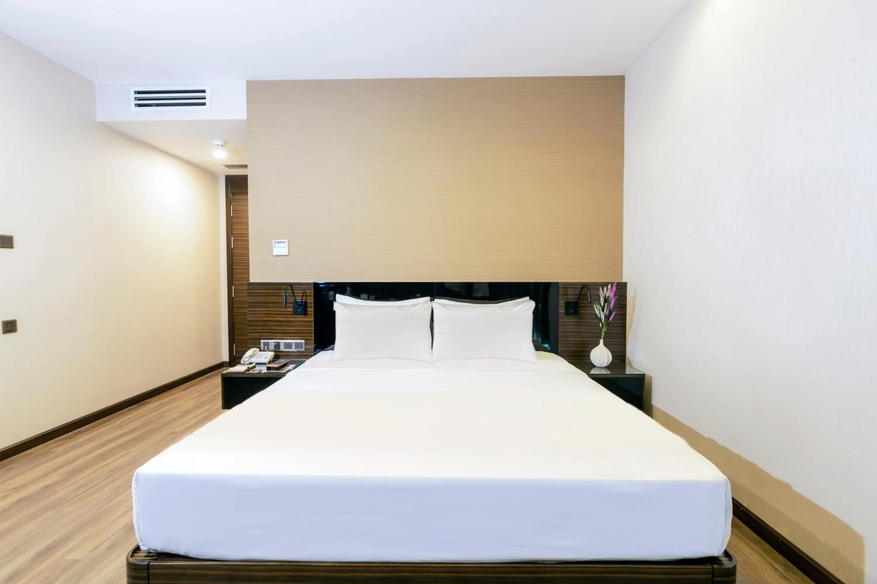 Bed in Queen Ann Hotel