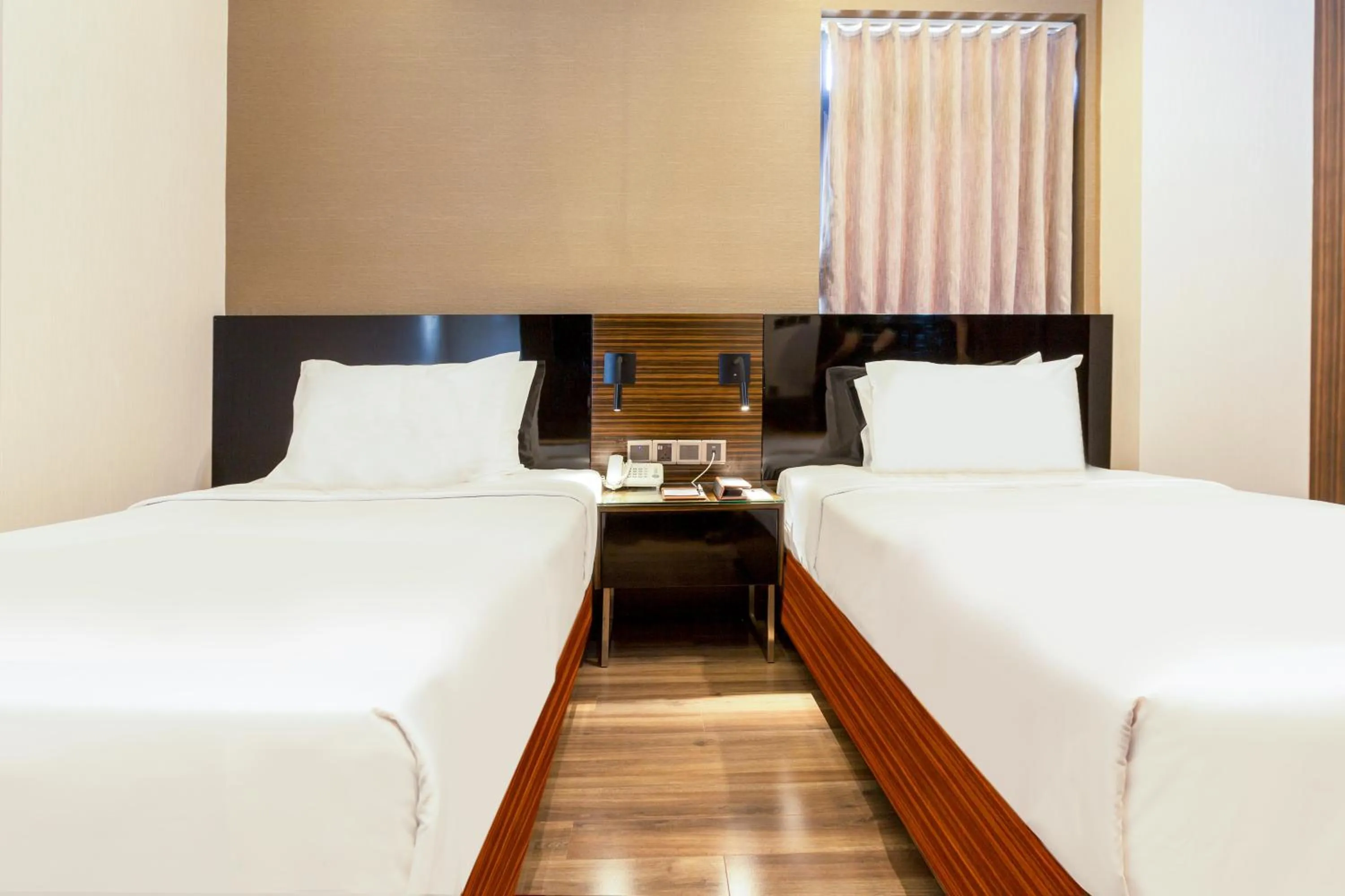 Bed in Queen Ann Hotel