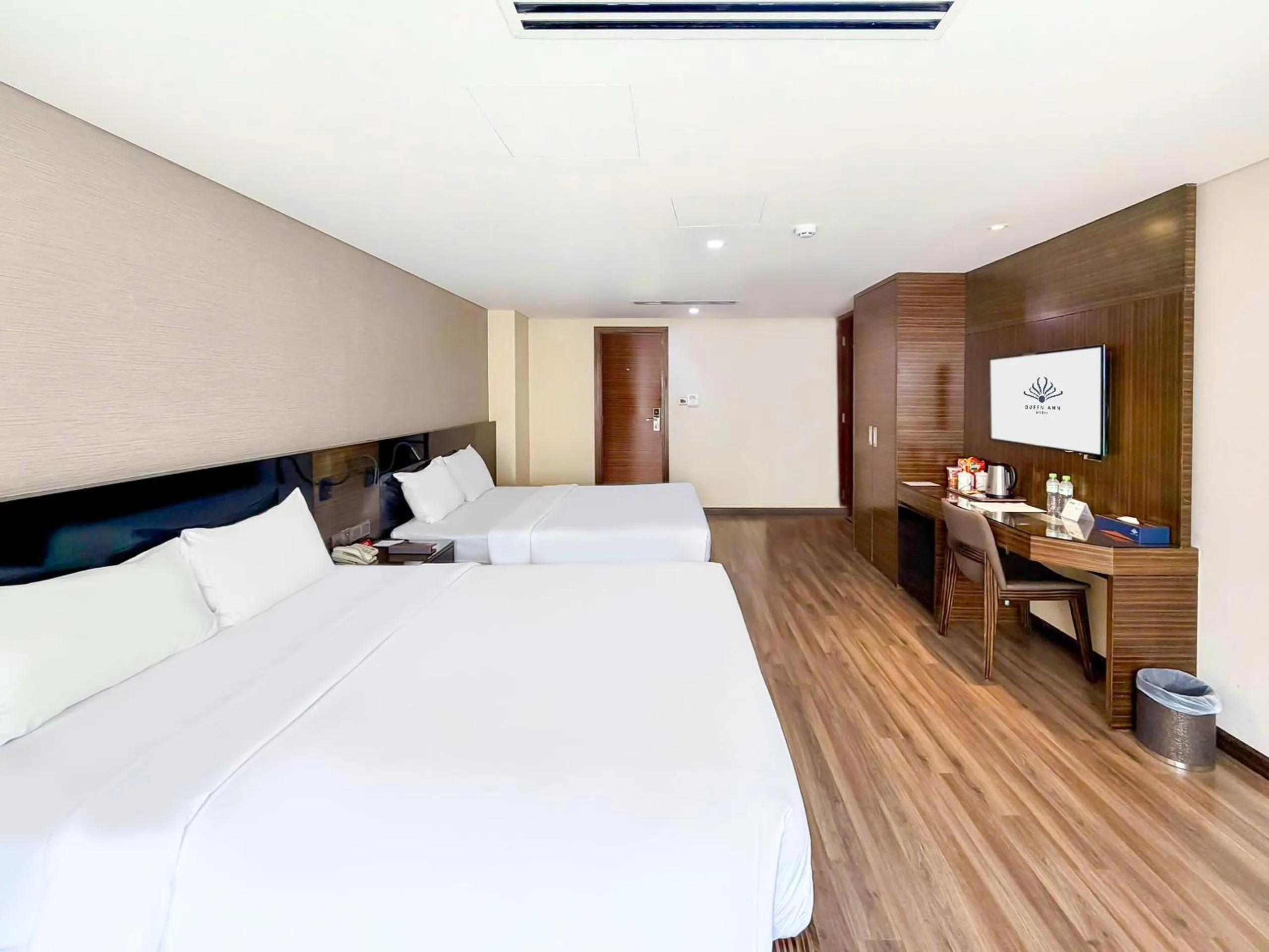 Bed in Queen Ann Hotel