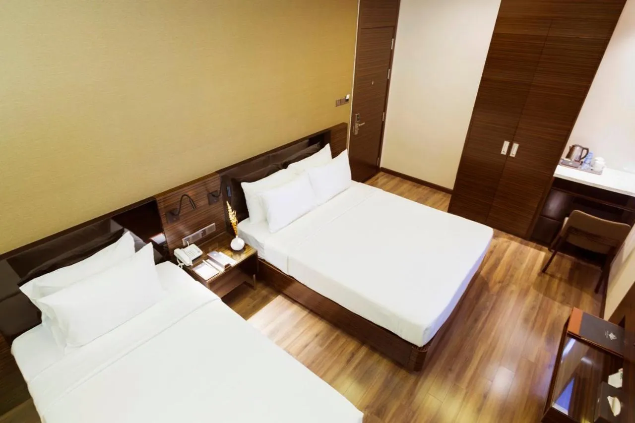 Bed in Queen Ann Hotel