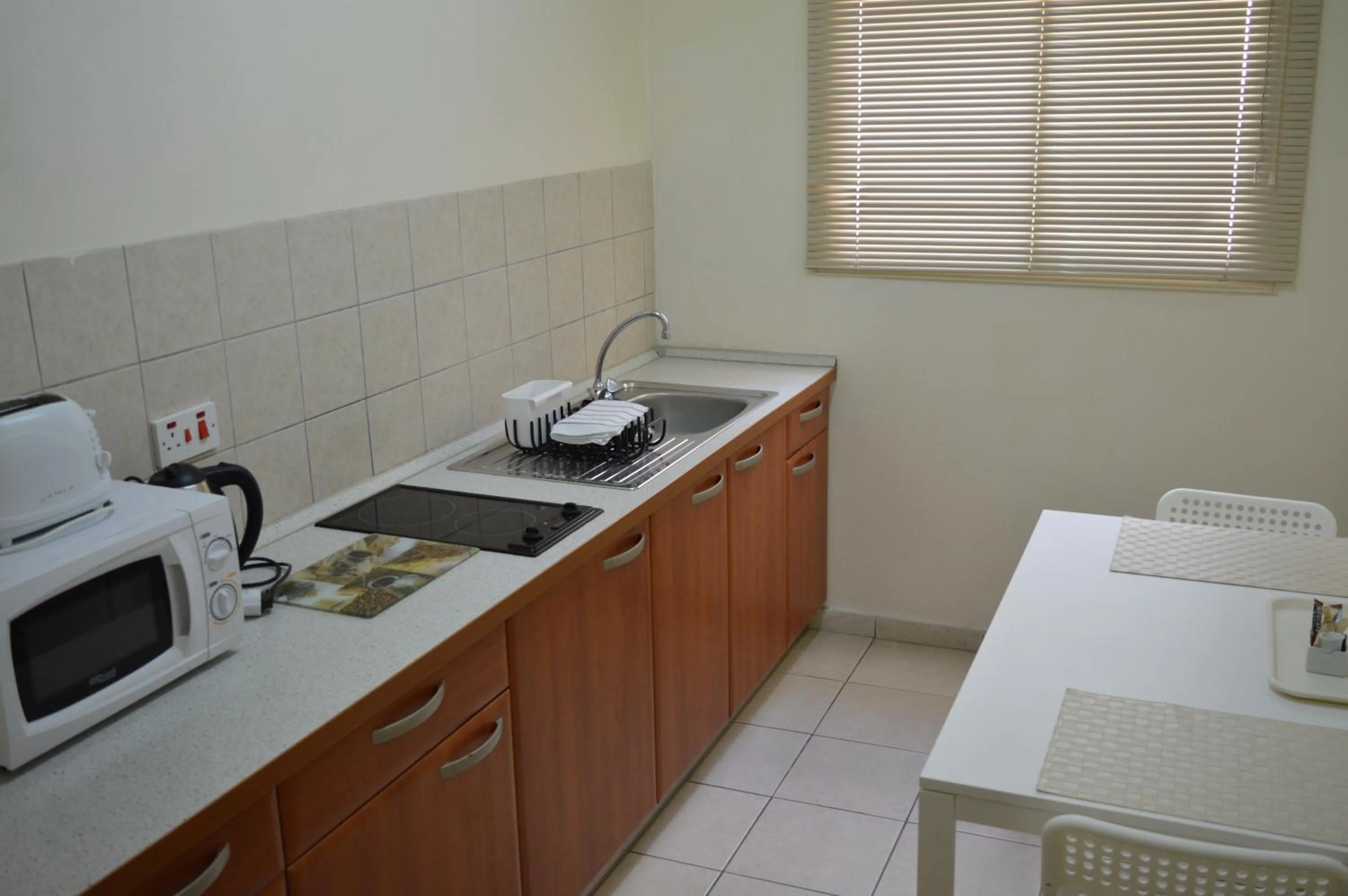 Kitchen or kitchenette in Lordos Hotel Apts Limassol