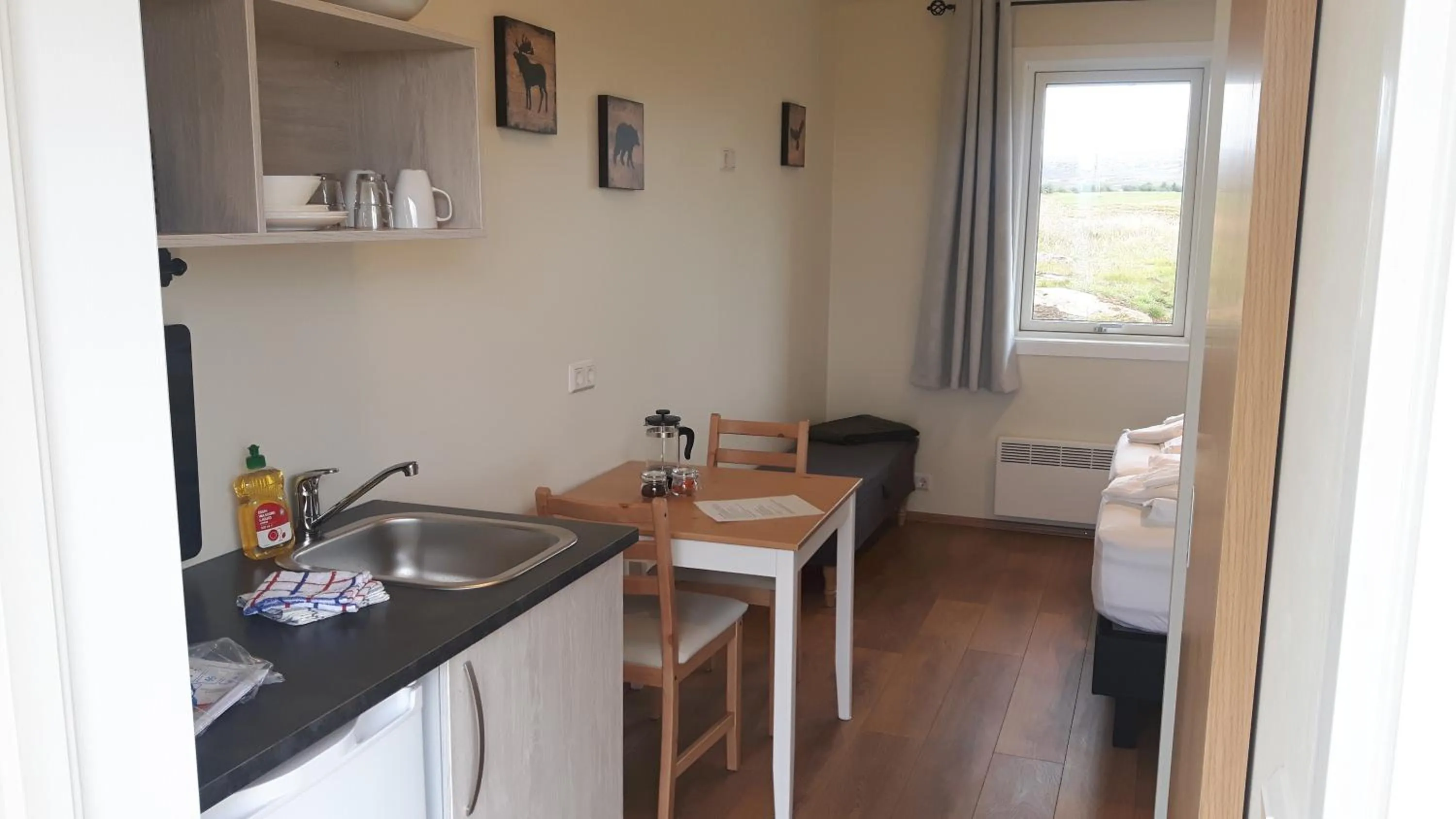 Kitchen or kitchenette in Hjartarstaðir Guesthouse