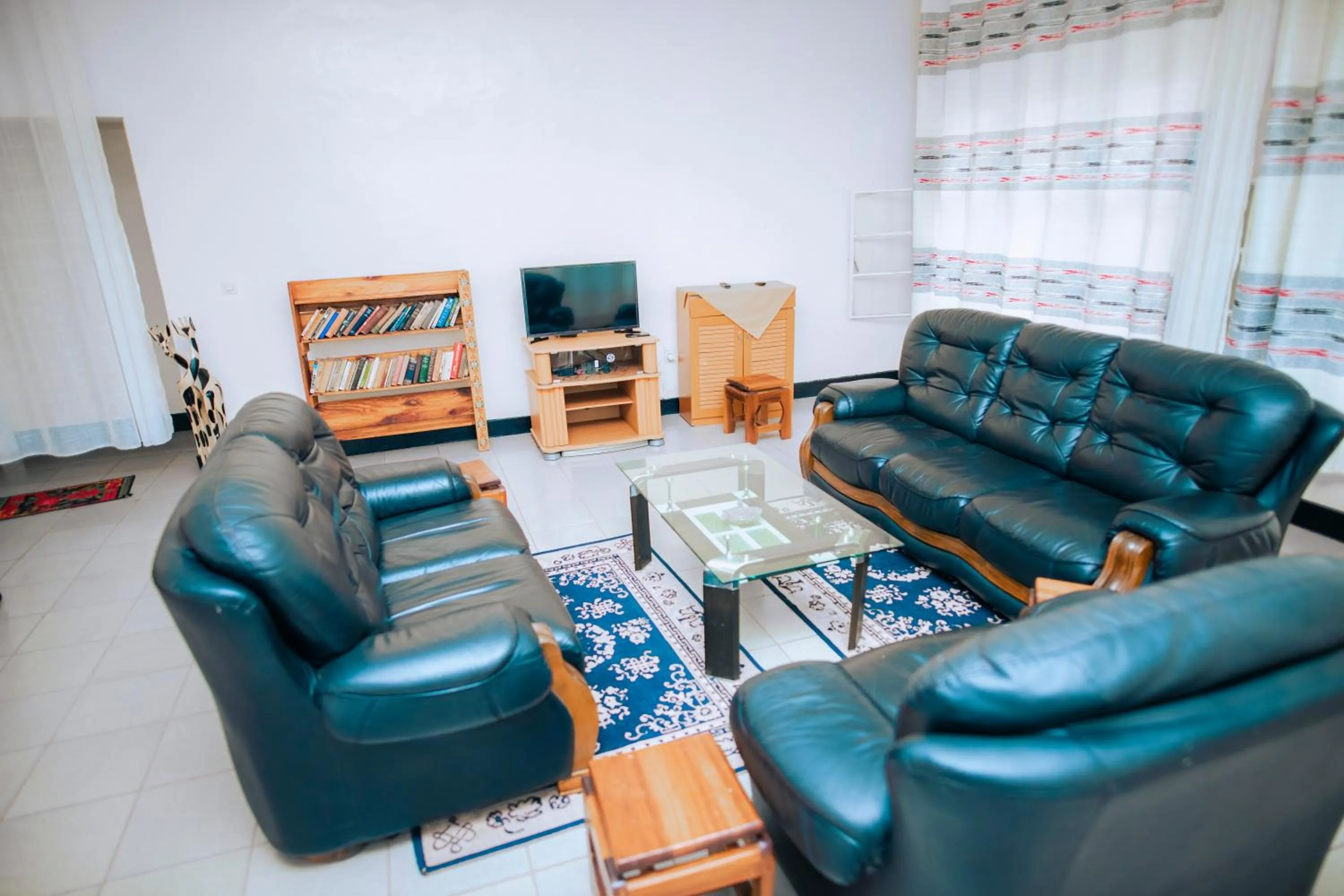 Communal lounge/ TV room in Hotel Peace Guest House