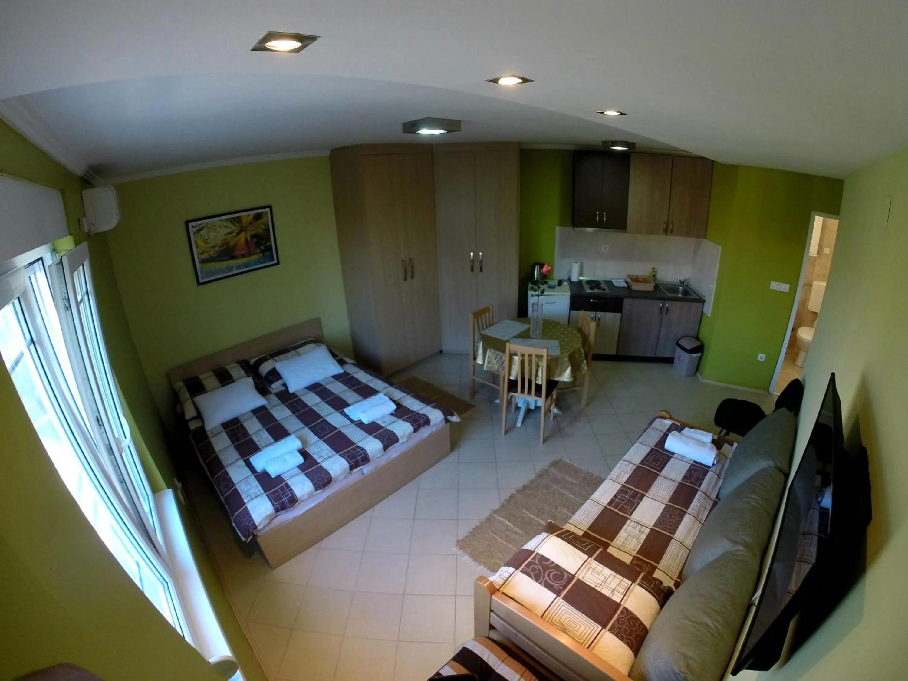 Kitchen or kitchenette, Bed in Apartments Popovic