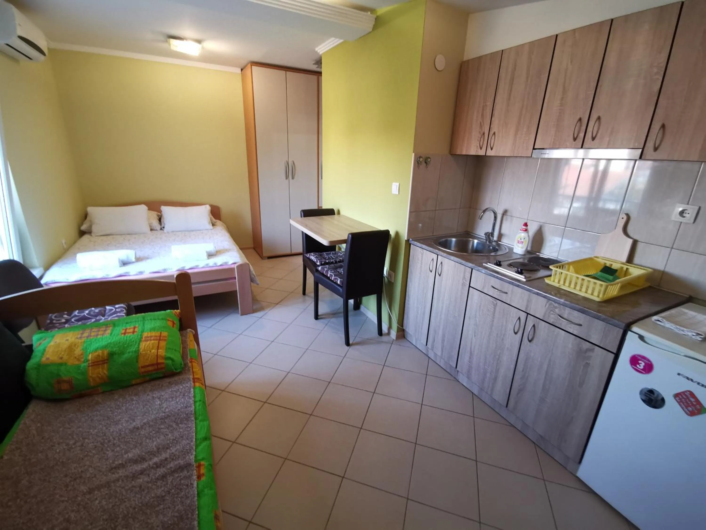 Kitchen or kitchenette, Bed in Apartments Popovic