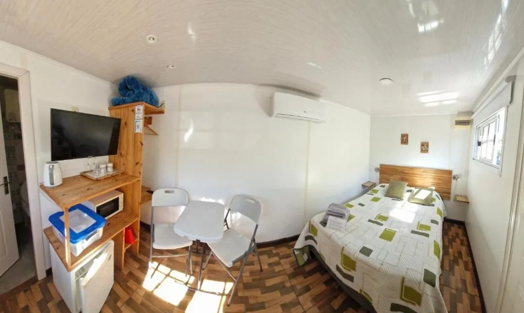 Bathroom, Bed in Squania Suite Container & Monoambientes