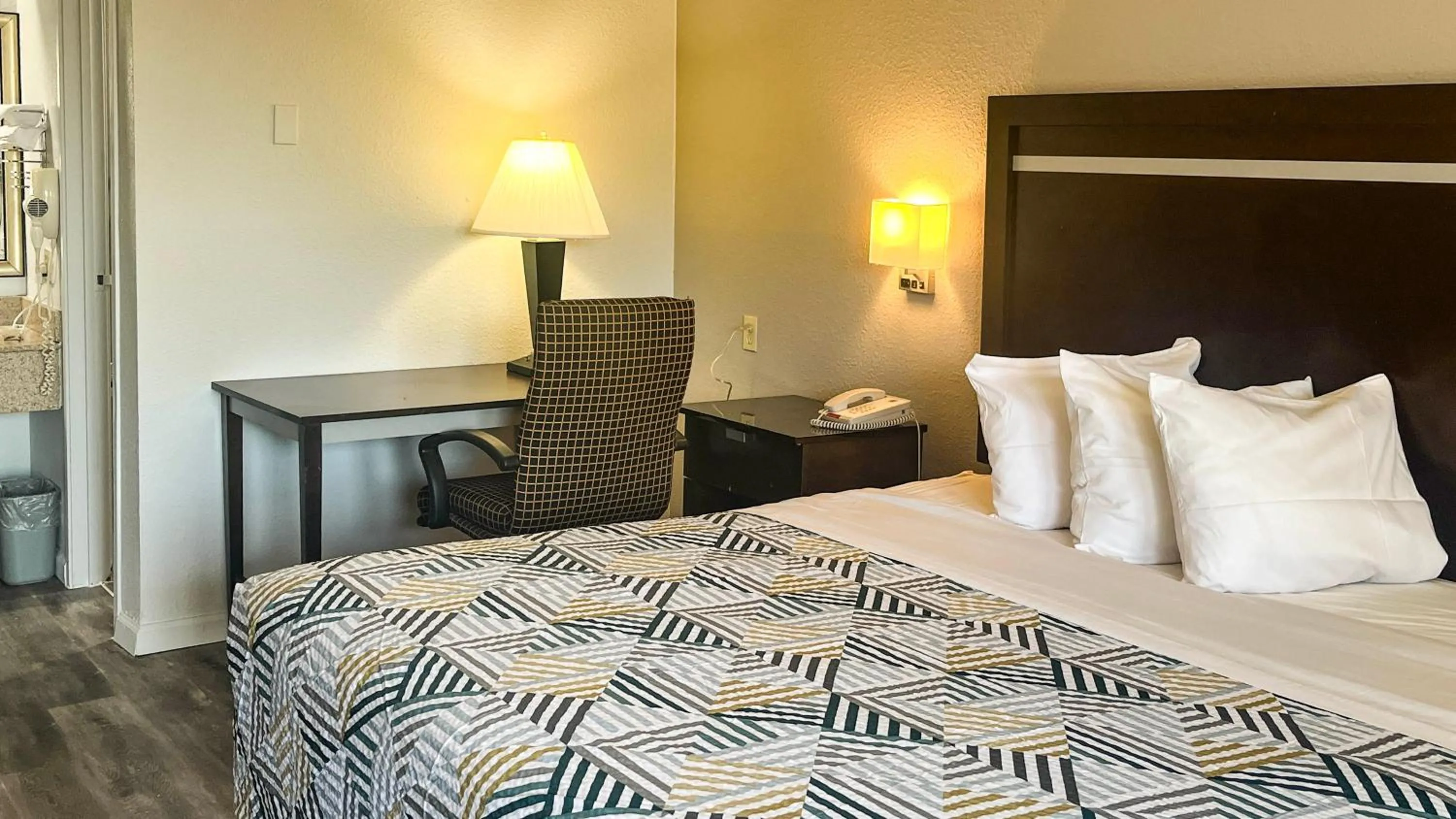 Bed in Studio 6 Suites Dallas TX - Loop 12 West