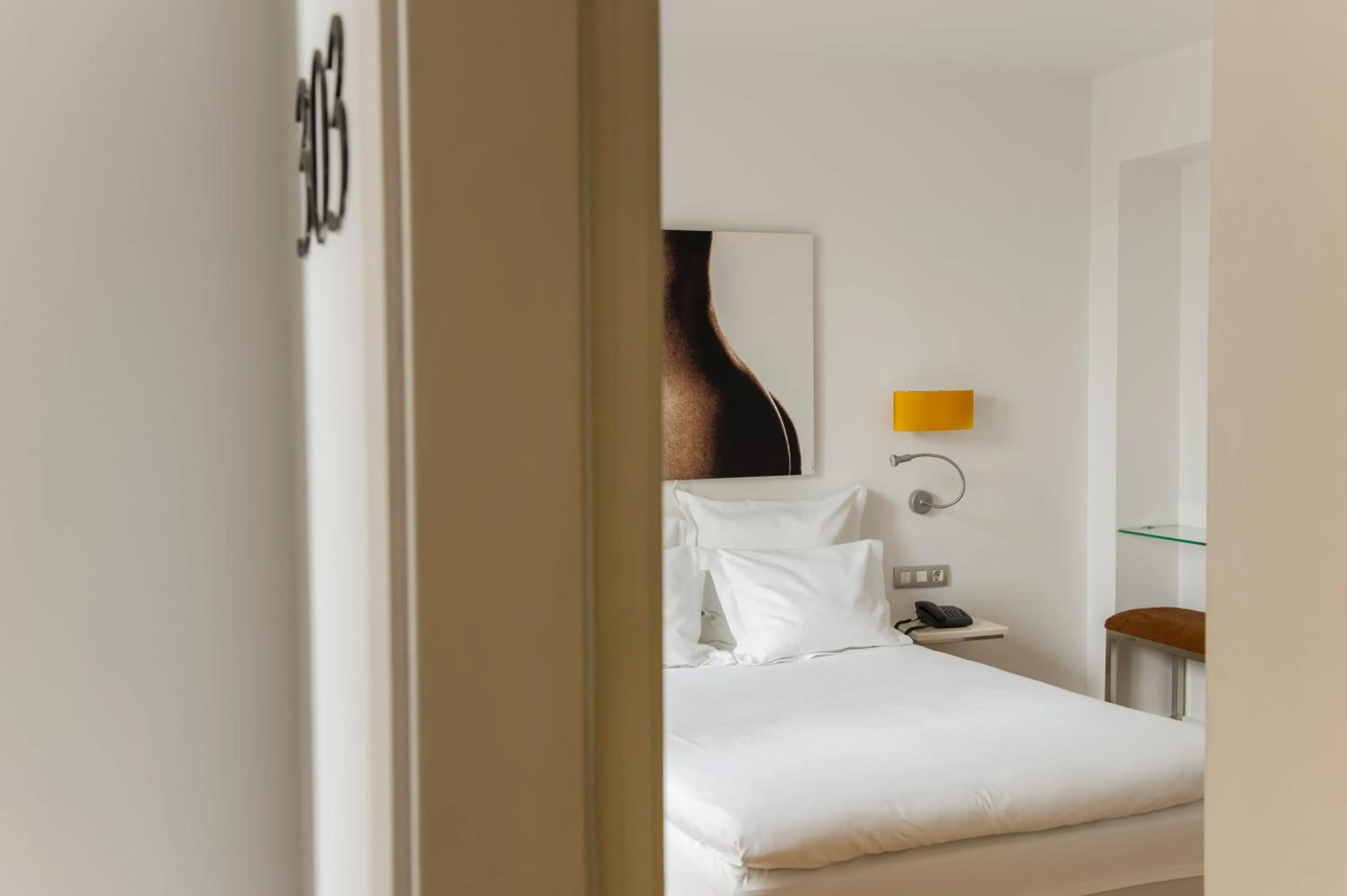 Bed in Petit Palace Hotel Tres