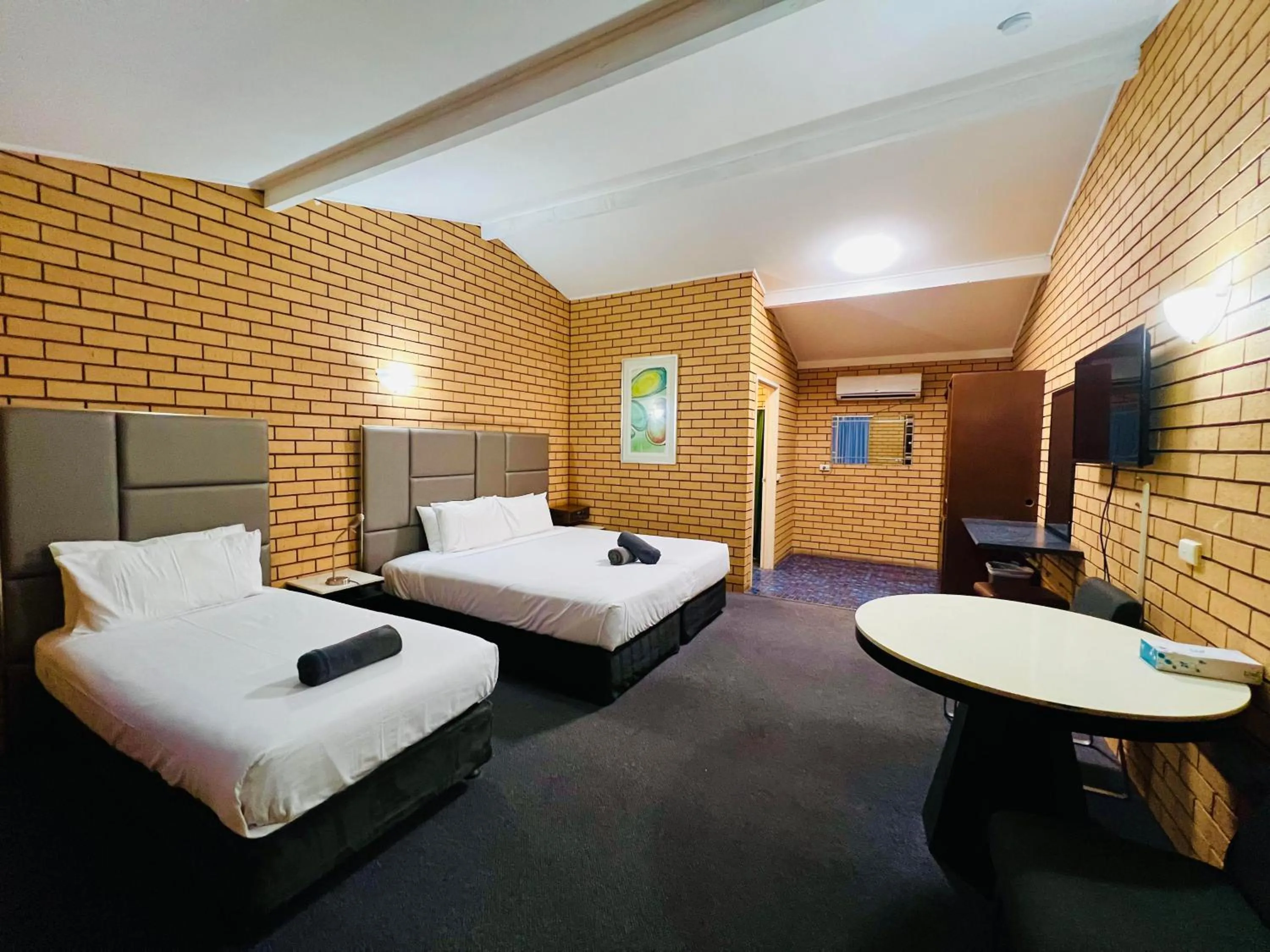 Bed in Stockman Motor Inn