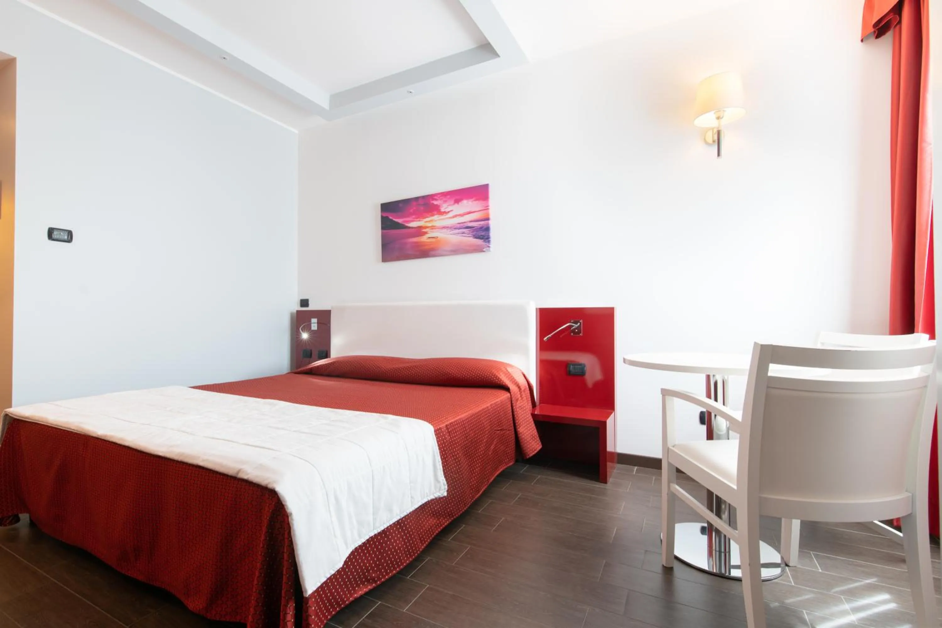 Seating area, Bed in Hotel Mediterraneo