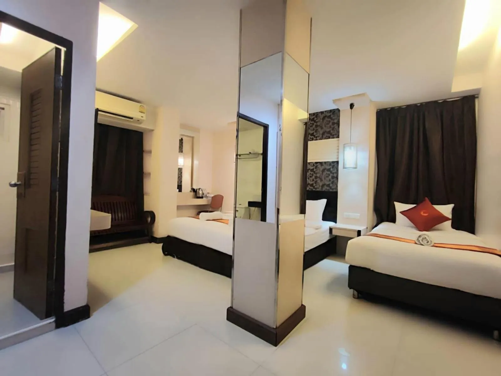 Bed in Cozi Inn Hotel, Bangkok