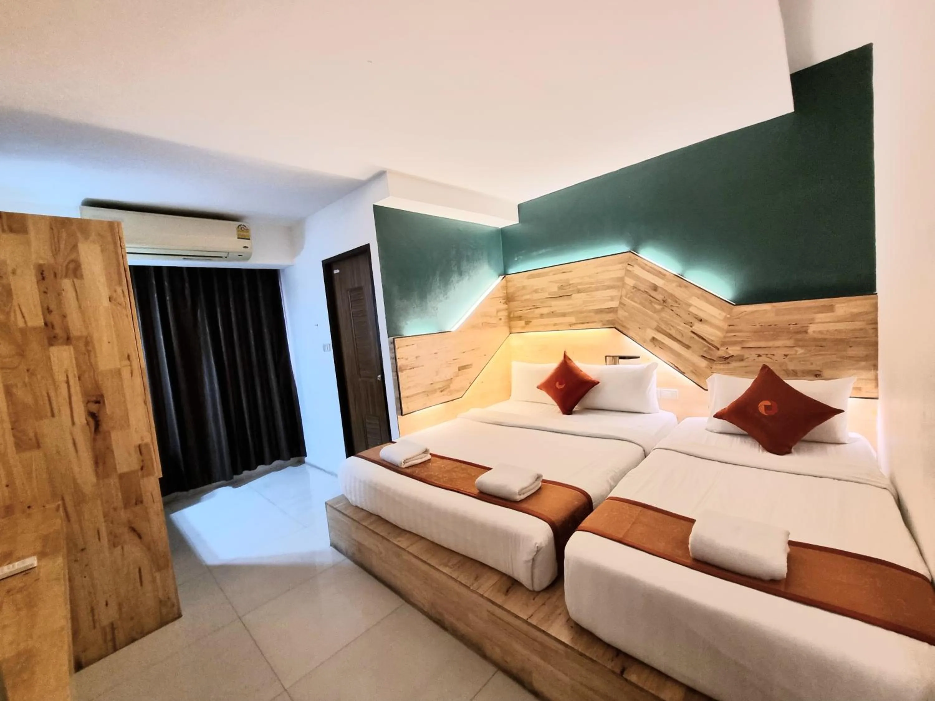 Bed in Cozi Inn Hotel, Bangkok