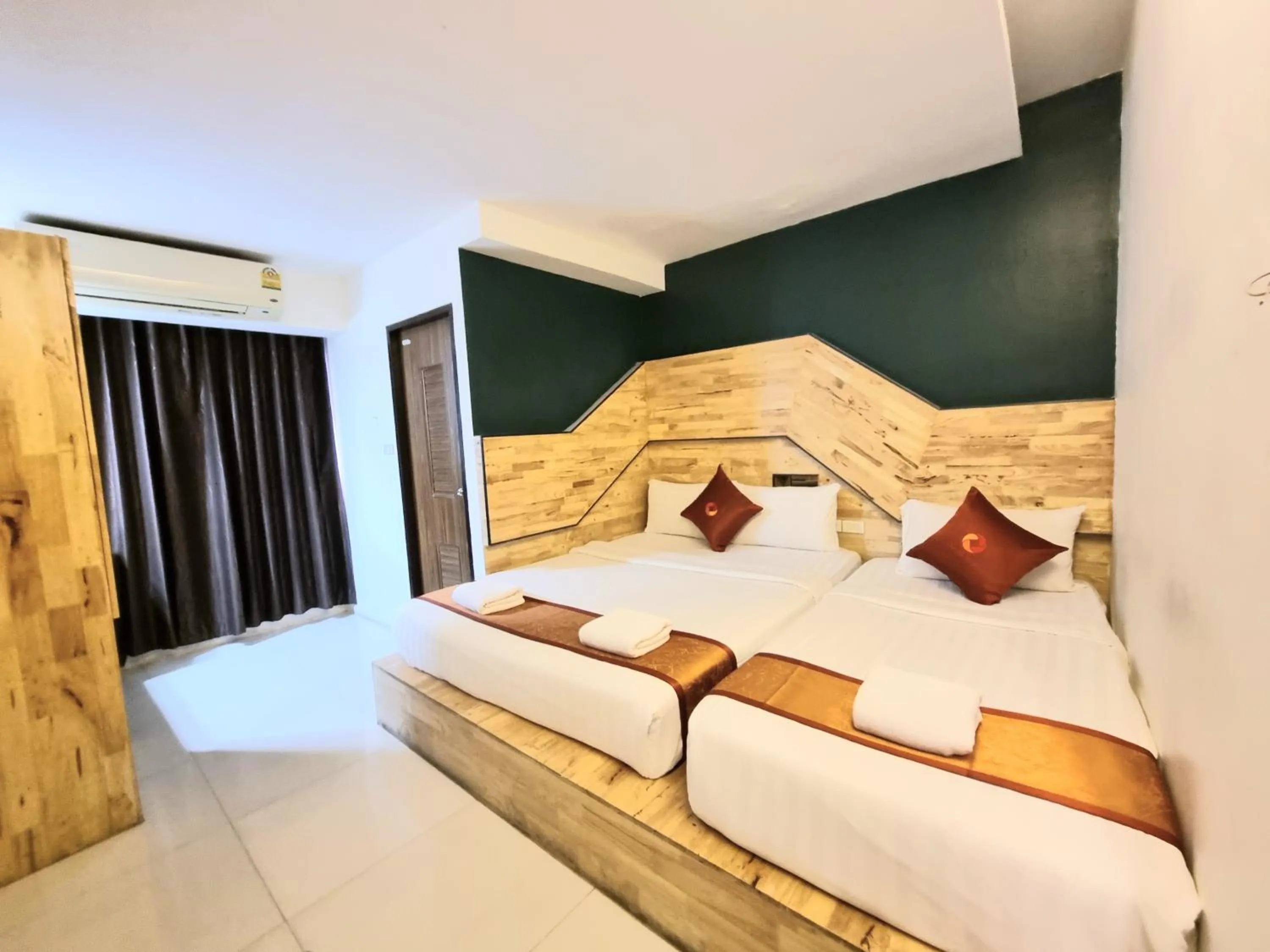 Bed in Cozi Inn Hotel, Bangkok