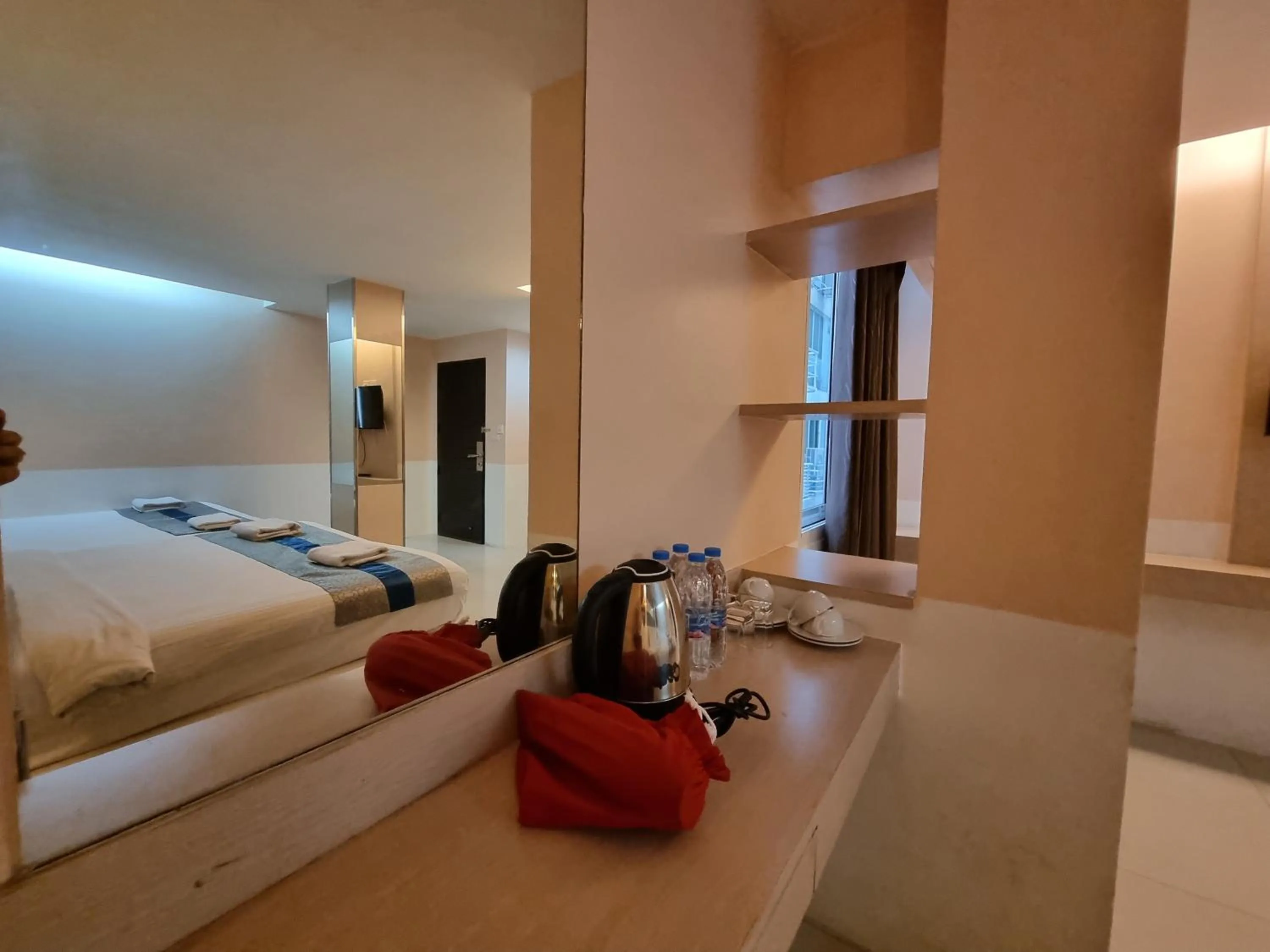 Bed in Cozi Inn Hotel, Bangkok