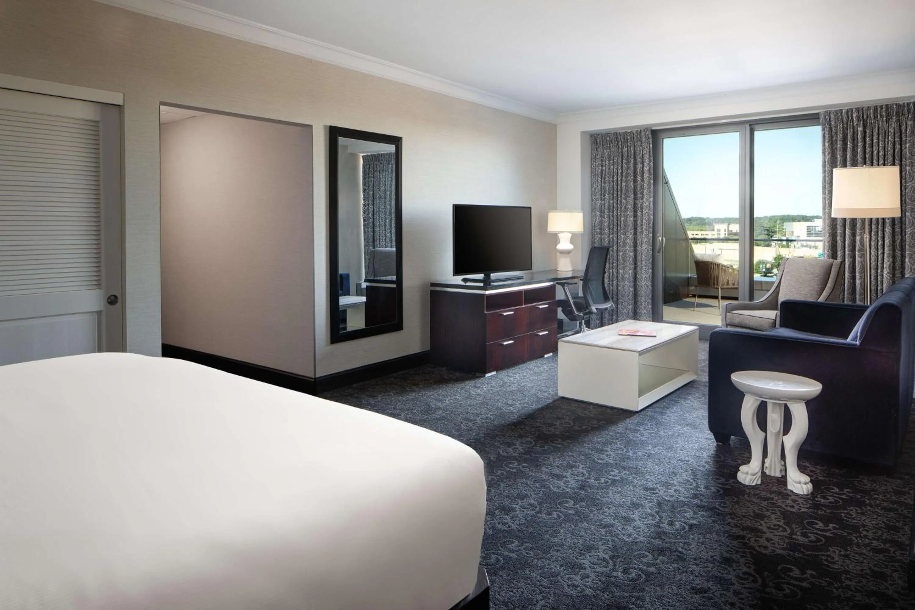 Living room, Bed in Amway Grand Plaza Hotel, Curio Collection by Hilton