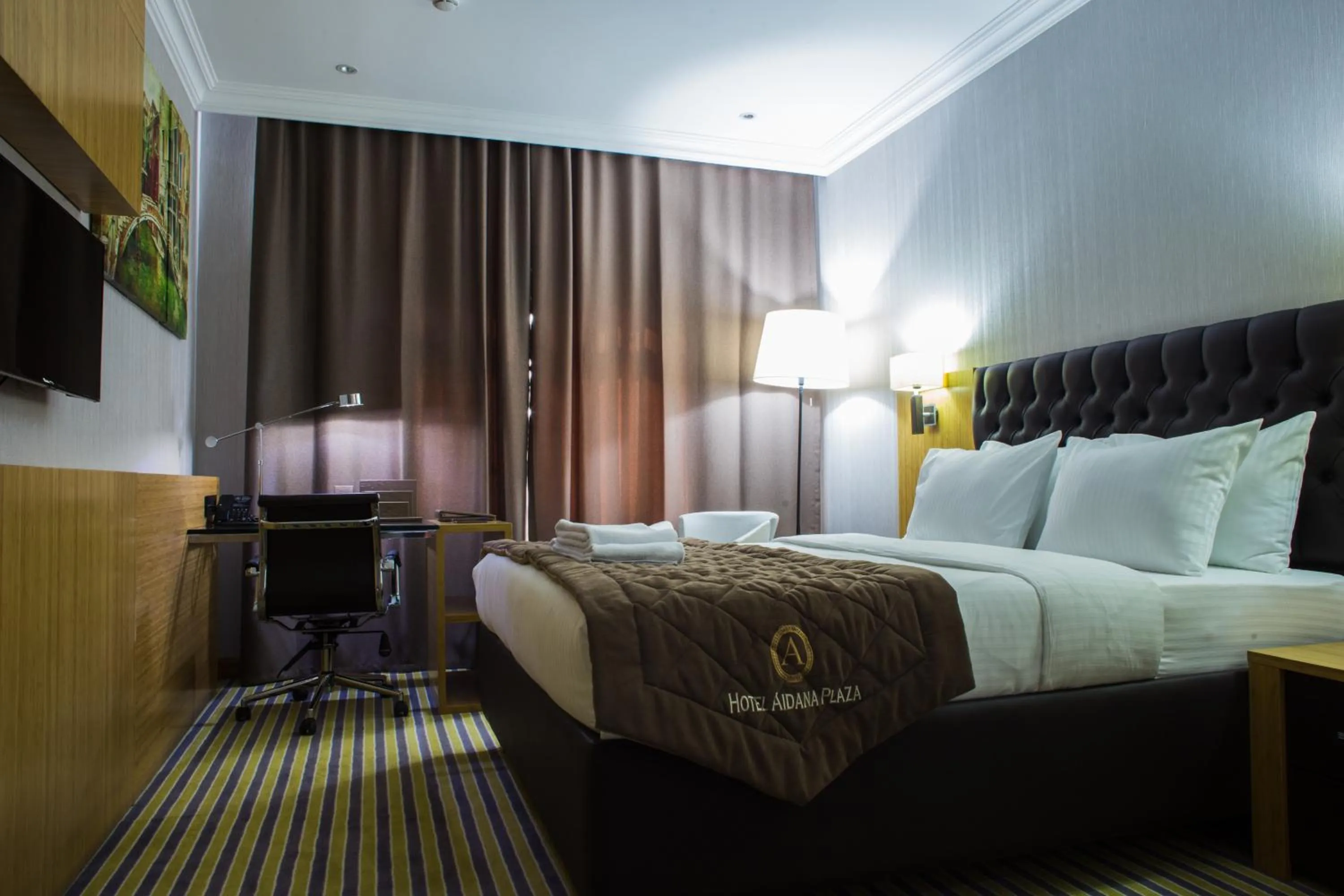 Bed in Aidana Plaza Hotel