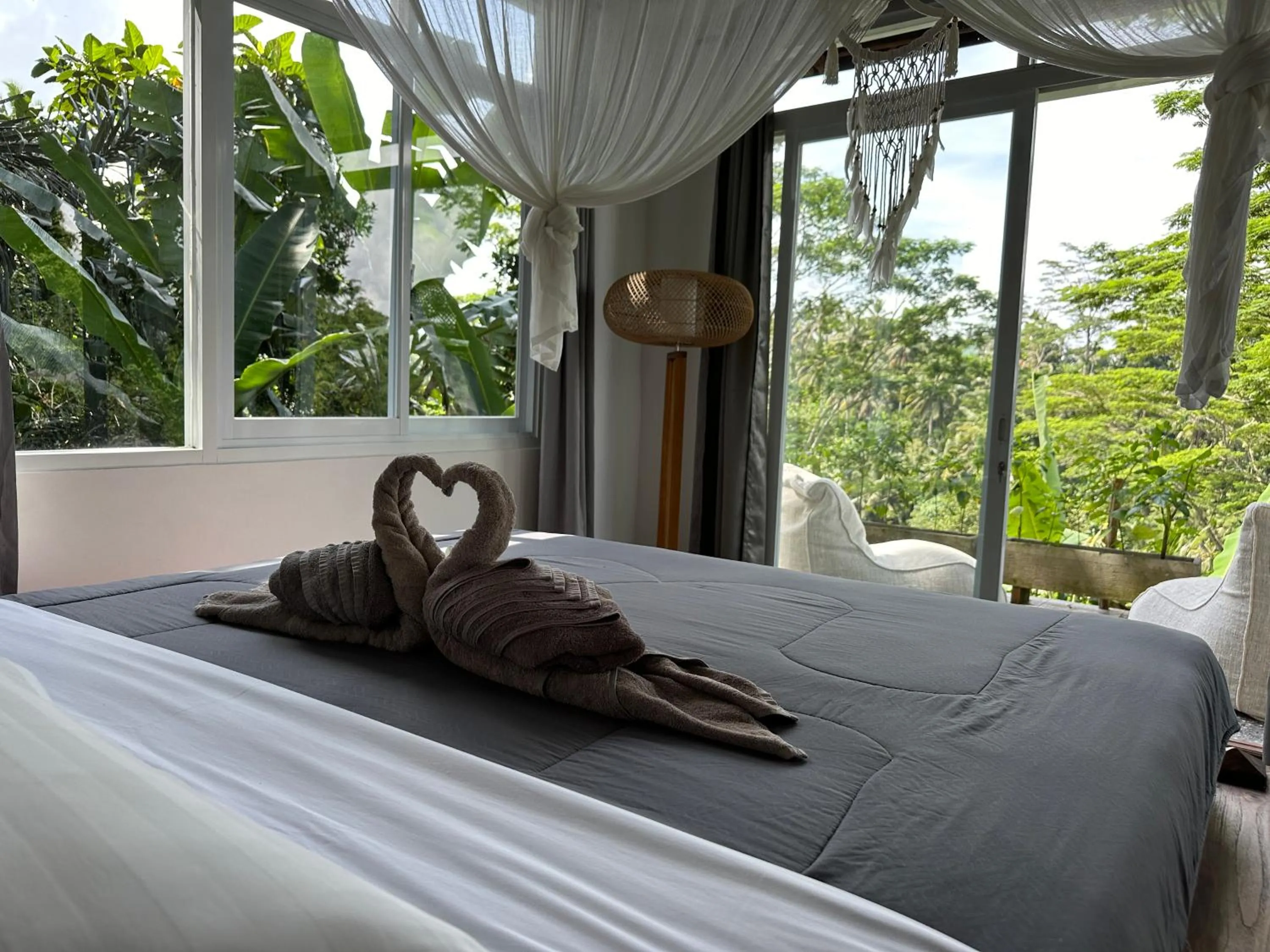 Bed in Tirta Asri Ubud Villa
