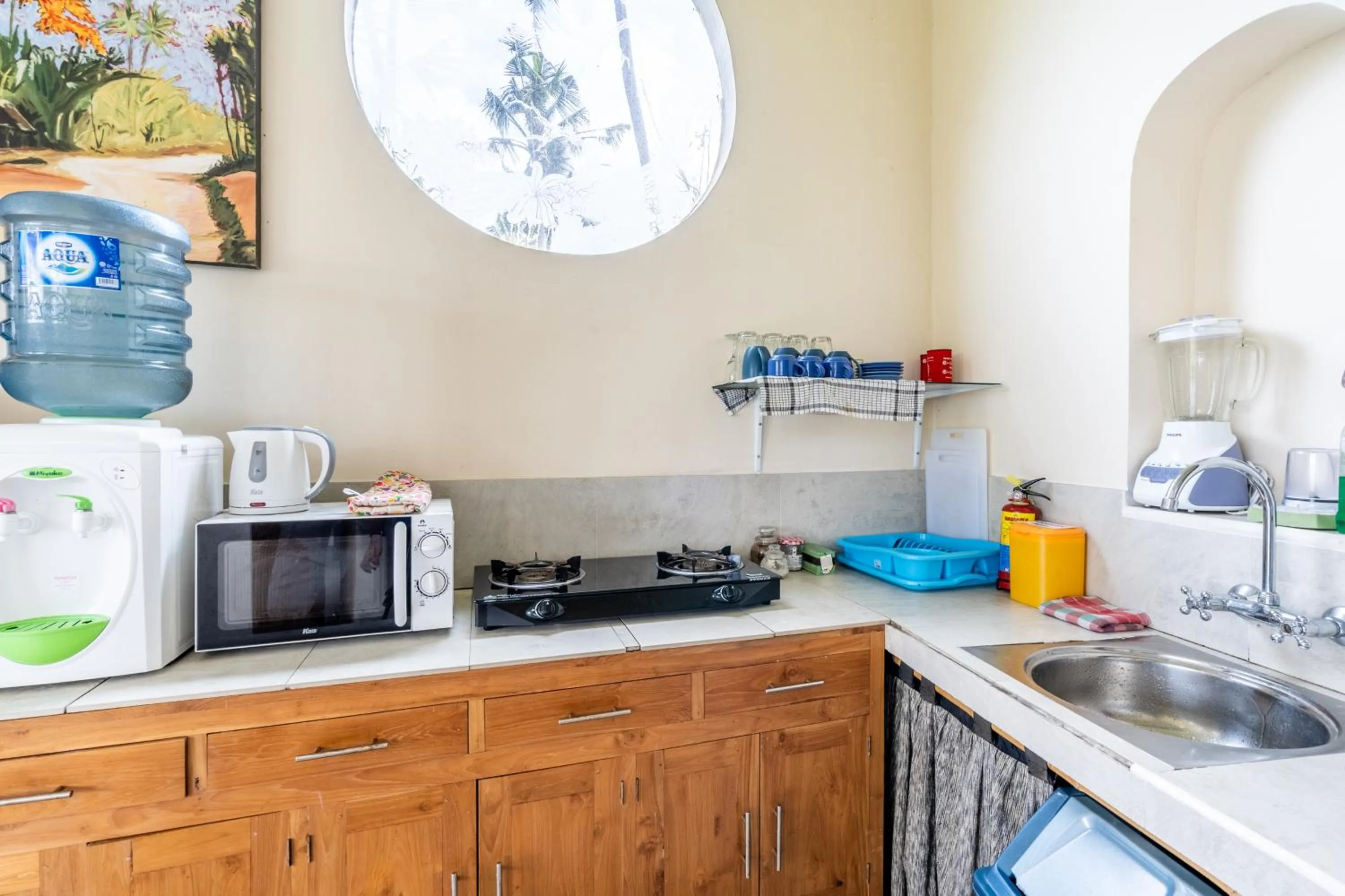 Kitchen or kitchenette in Tirta Asri Ubud Villa