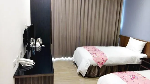 Bed in Sendale Zhubei Business Hotel