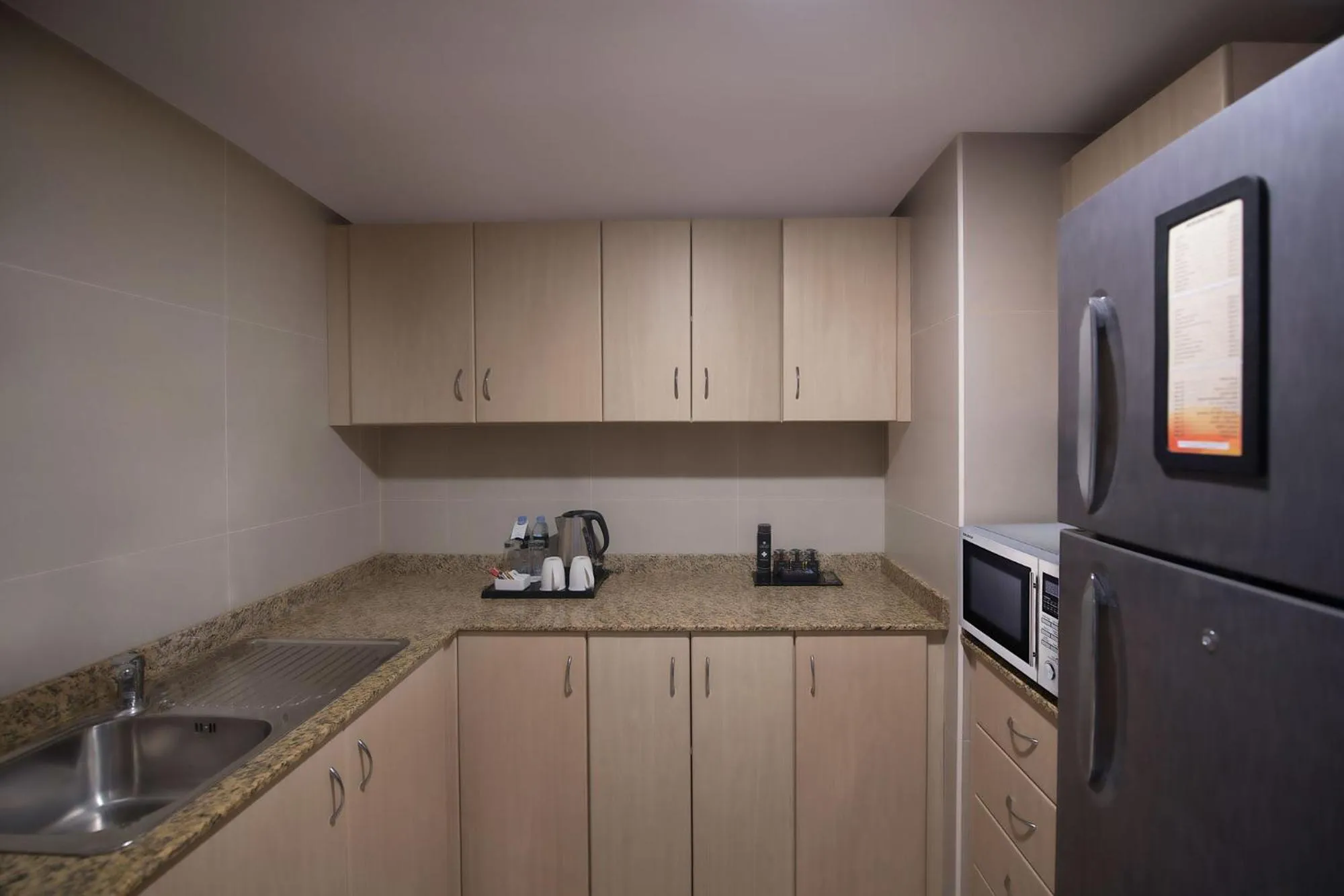 Kitchen or kitchenette in Two Seasons Hotel & Apartments