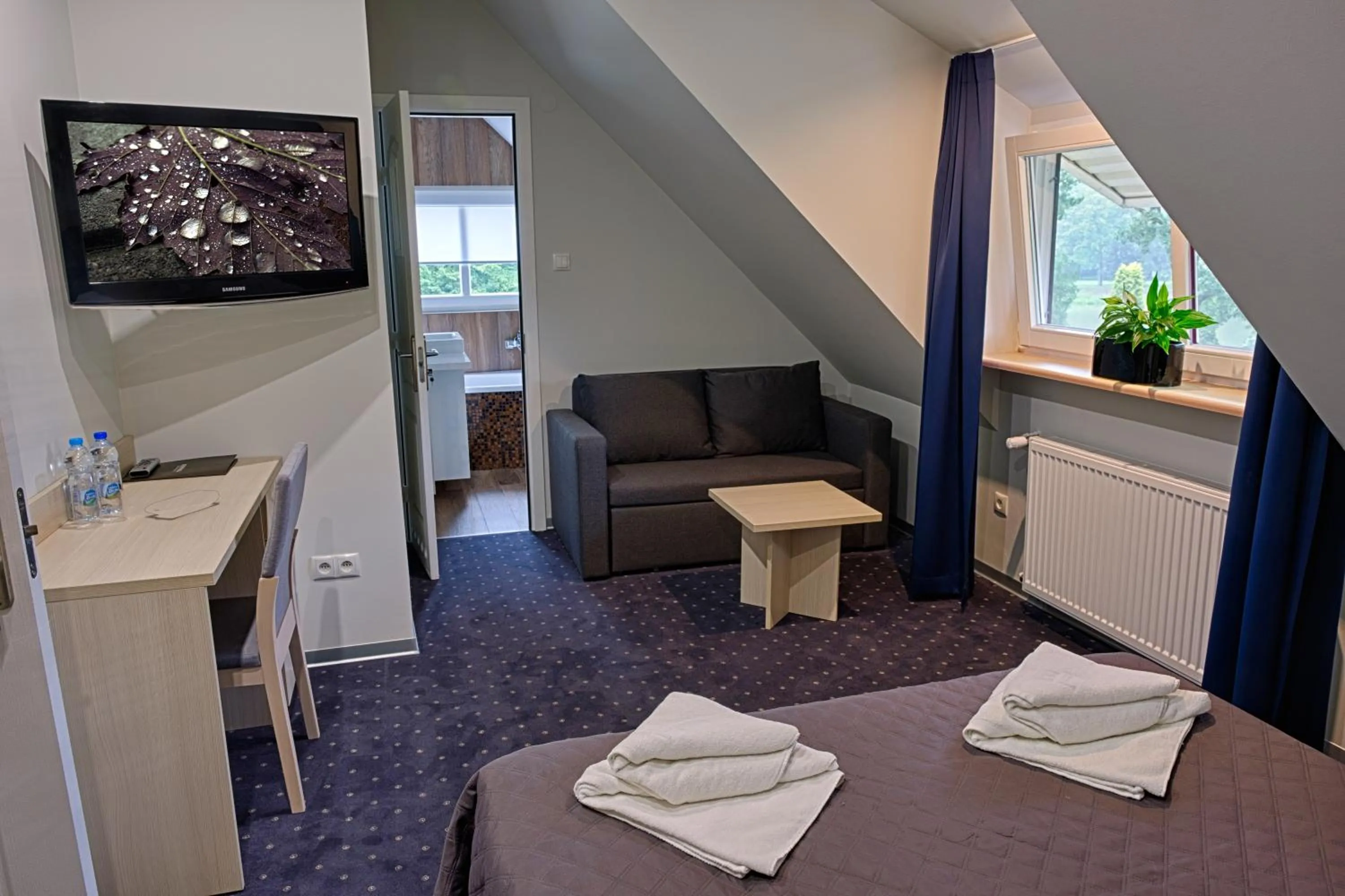 Bathroom, Bed in Hotel Podjadek