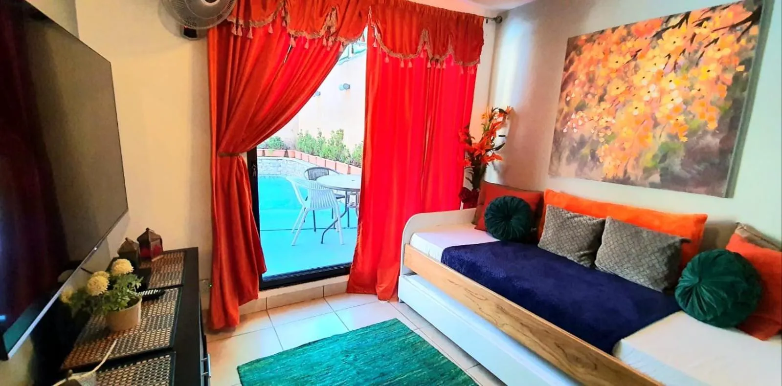 Communal lounge/ TV room, Bed in El Encanto Condominiums