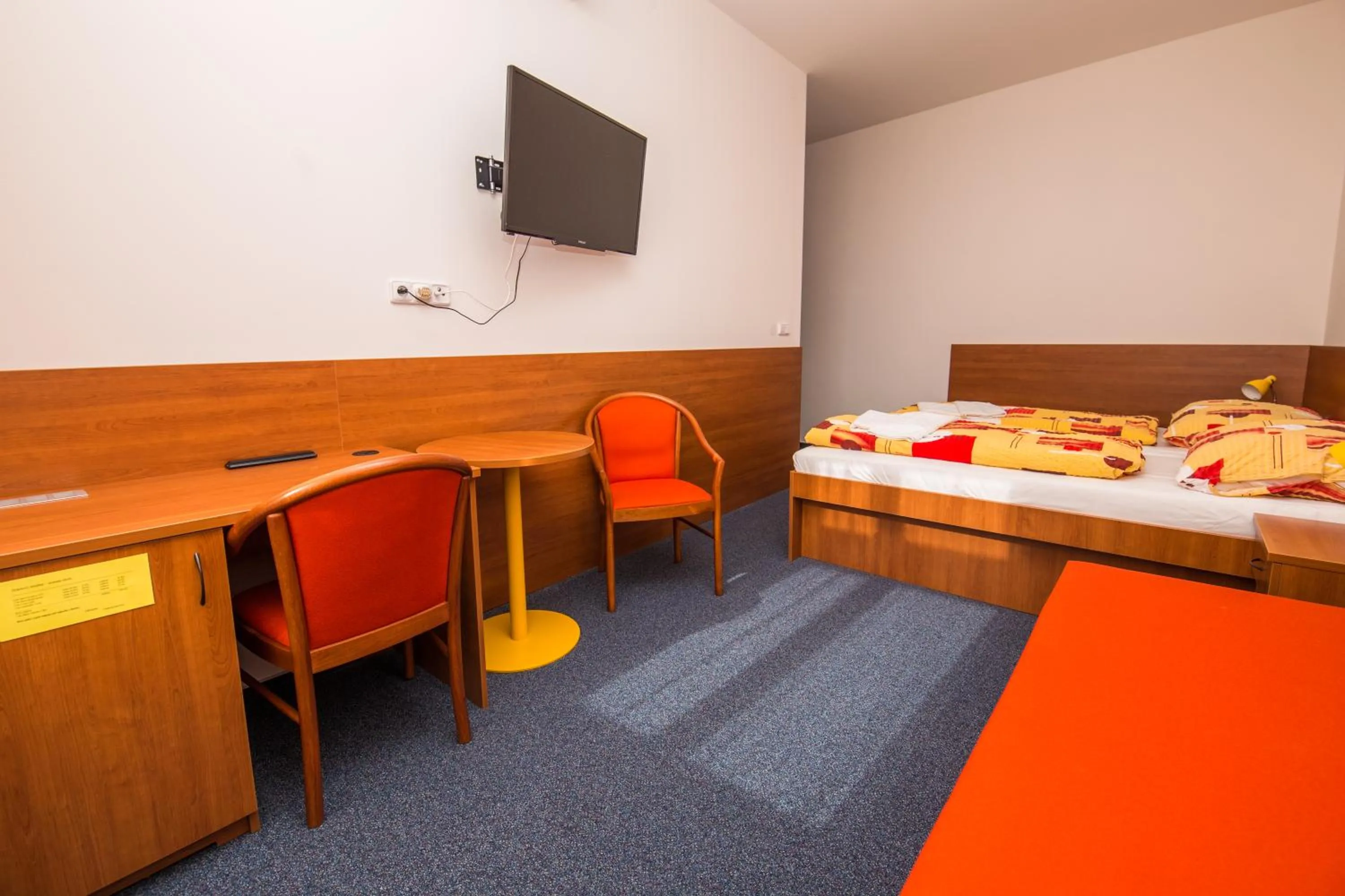 Seating area, Bed in Hotel Morava