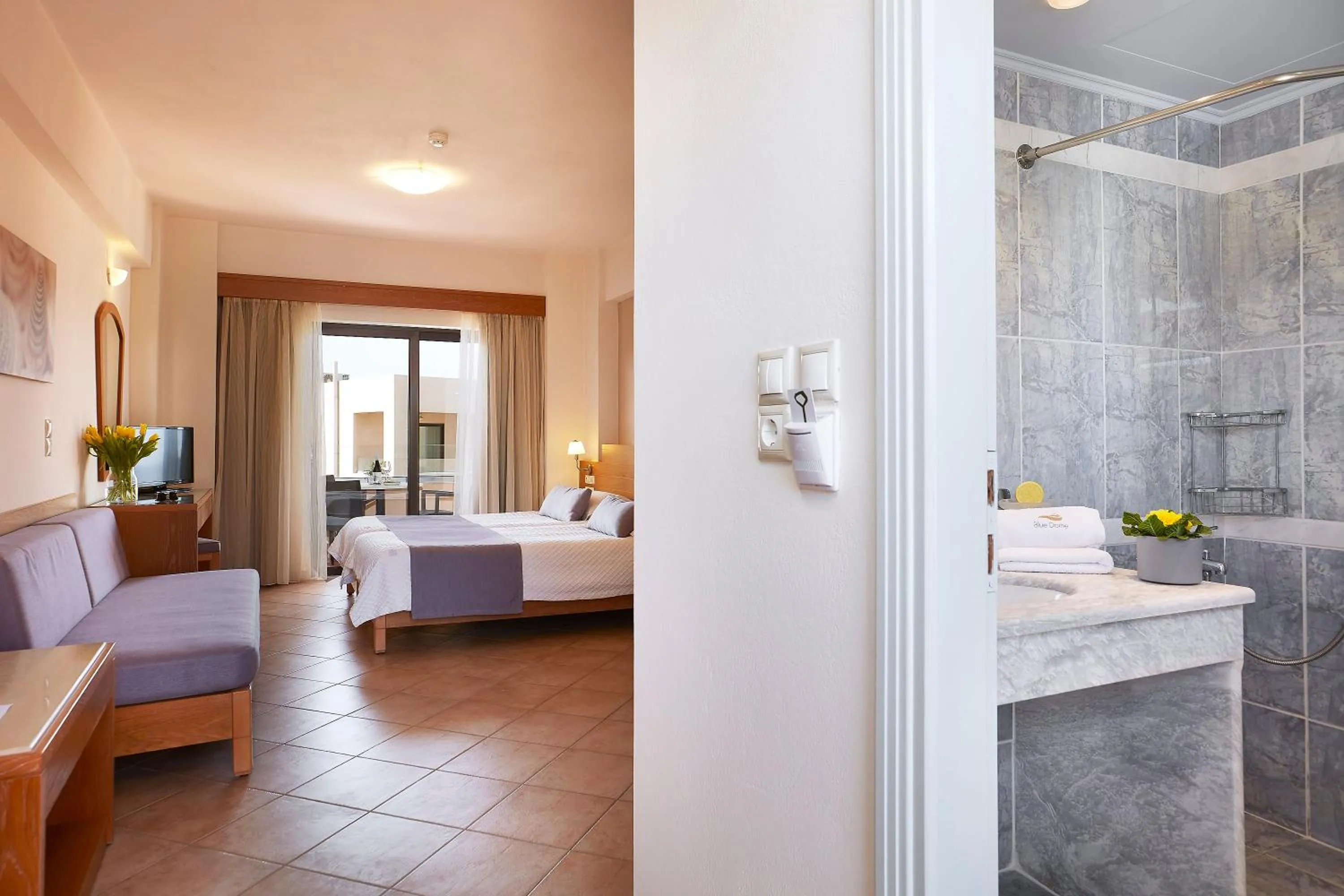 Toilet, Bed in Blue Dome Hotel