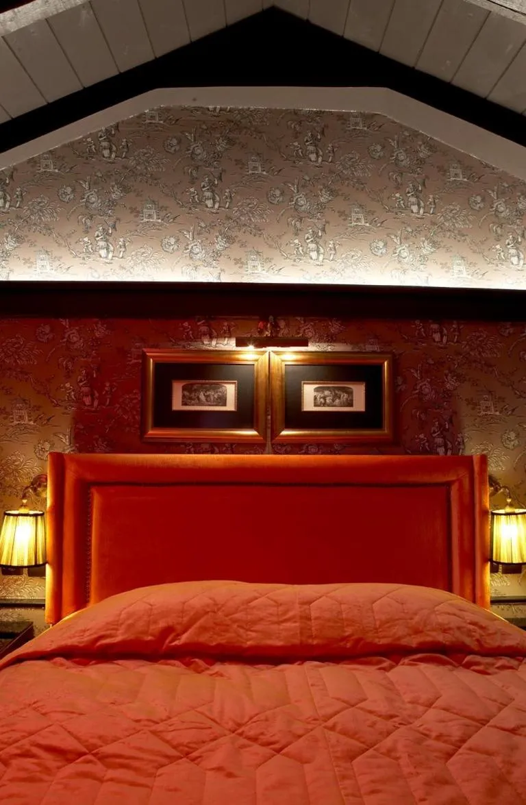 Bed in Maison Grecque Hotel Extraordinaire