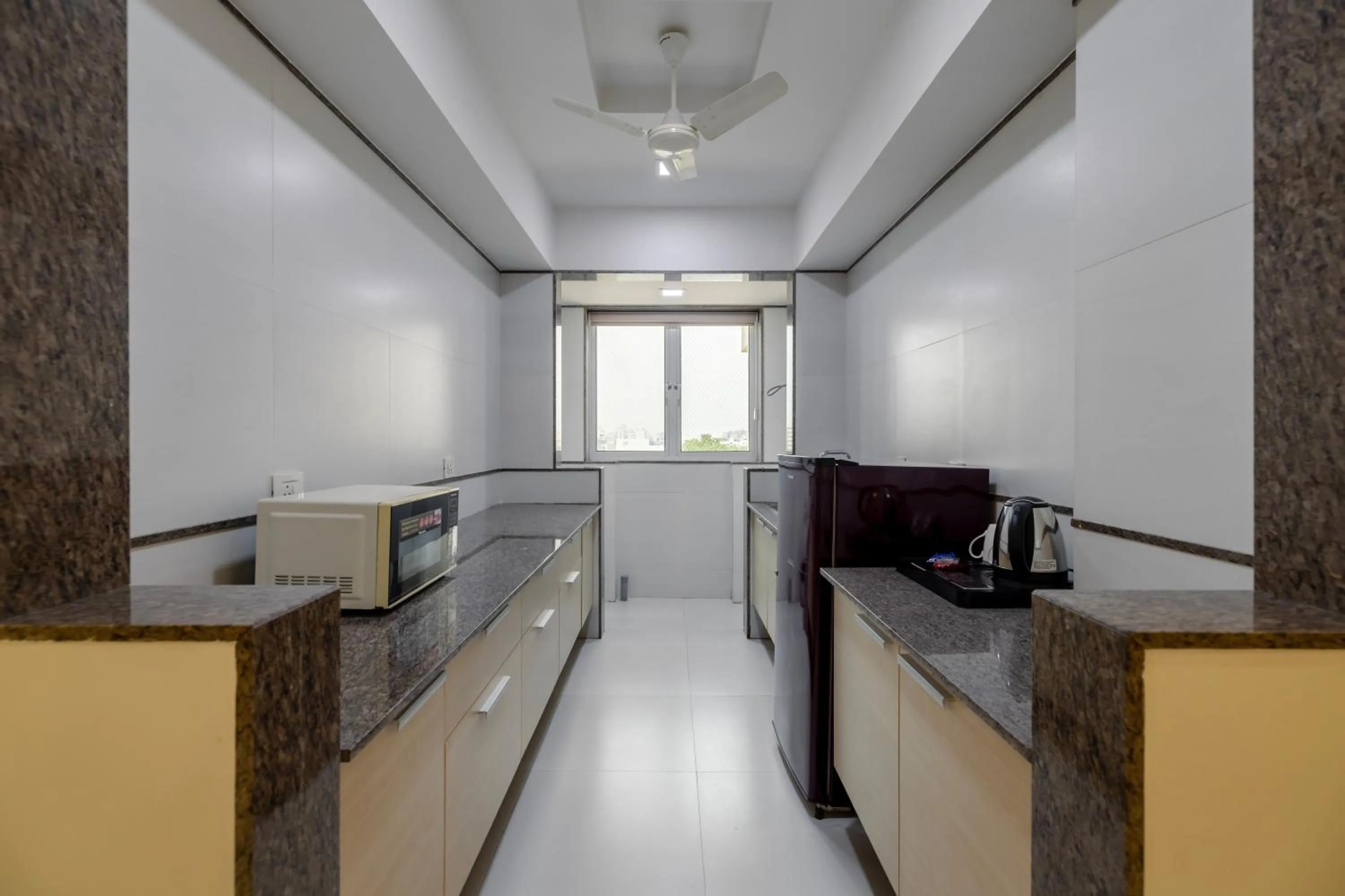 kitchen in Quality Inn Patria Suites, Rajkot