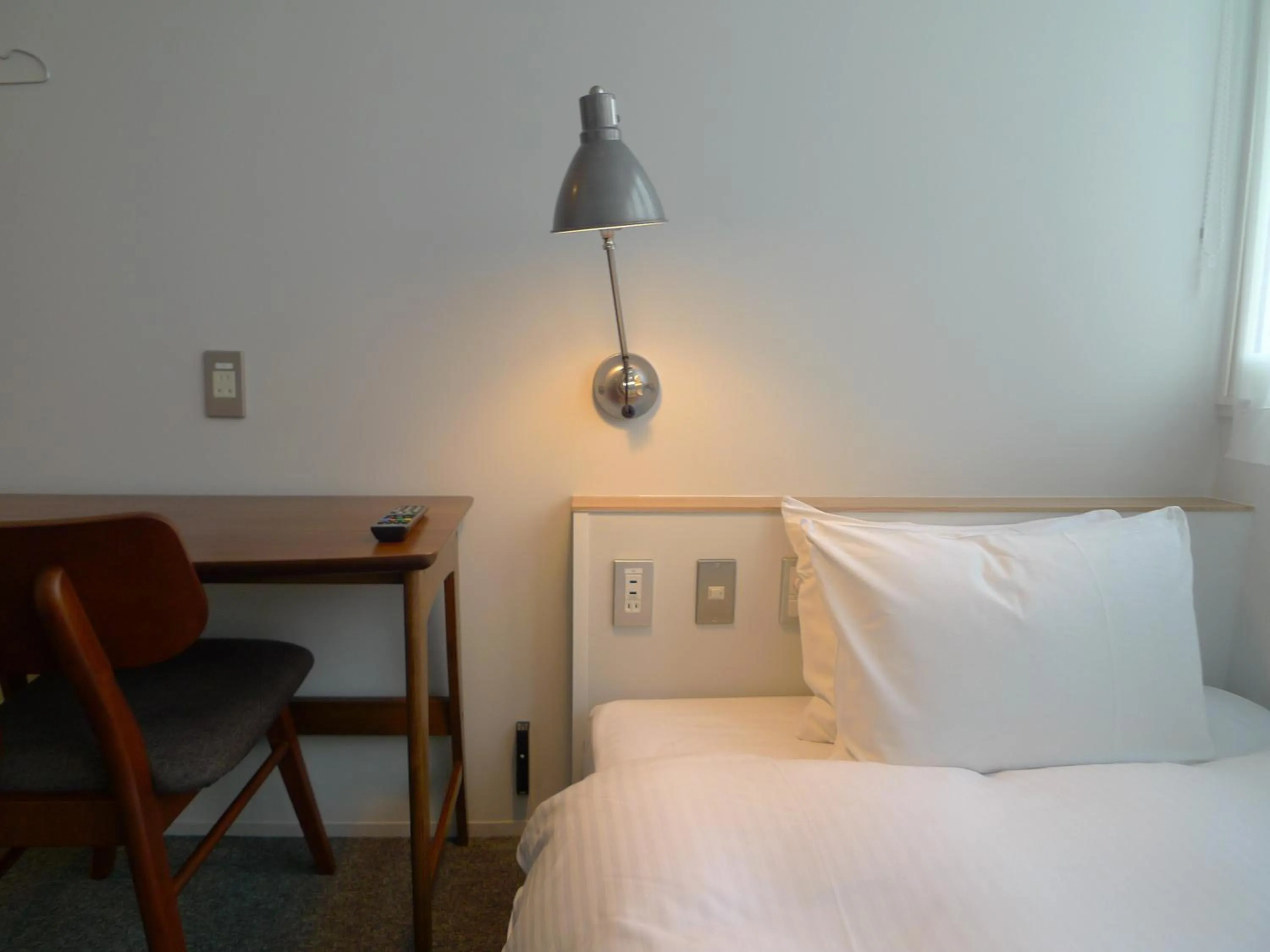 Living room, Bed in Hotel Potmum Sapporo