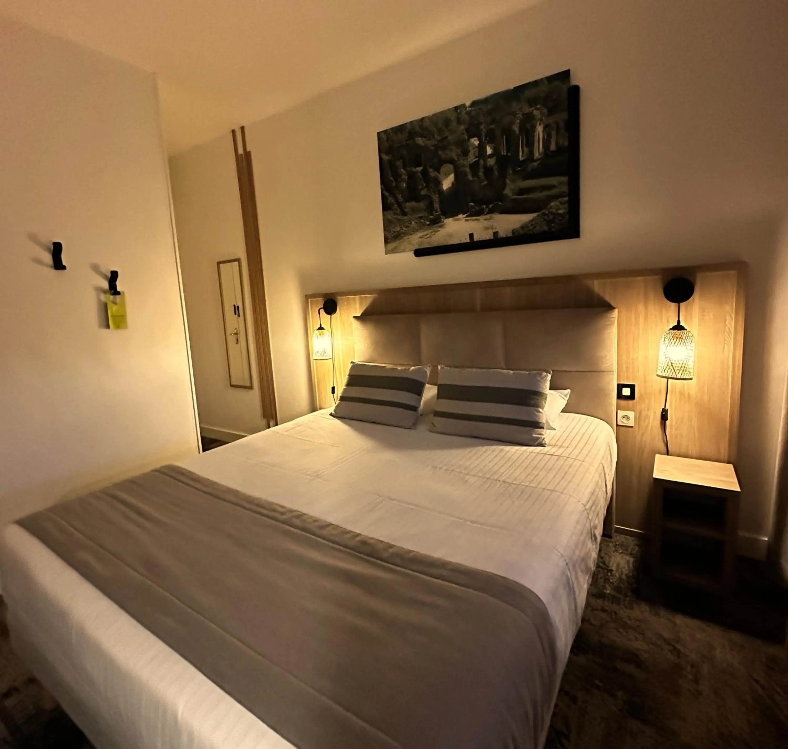 Photo of the whole room, Bed in Logis Le Passiflore Cognac