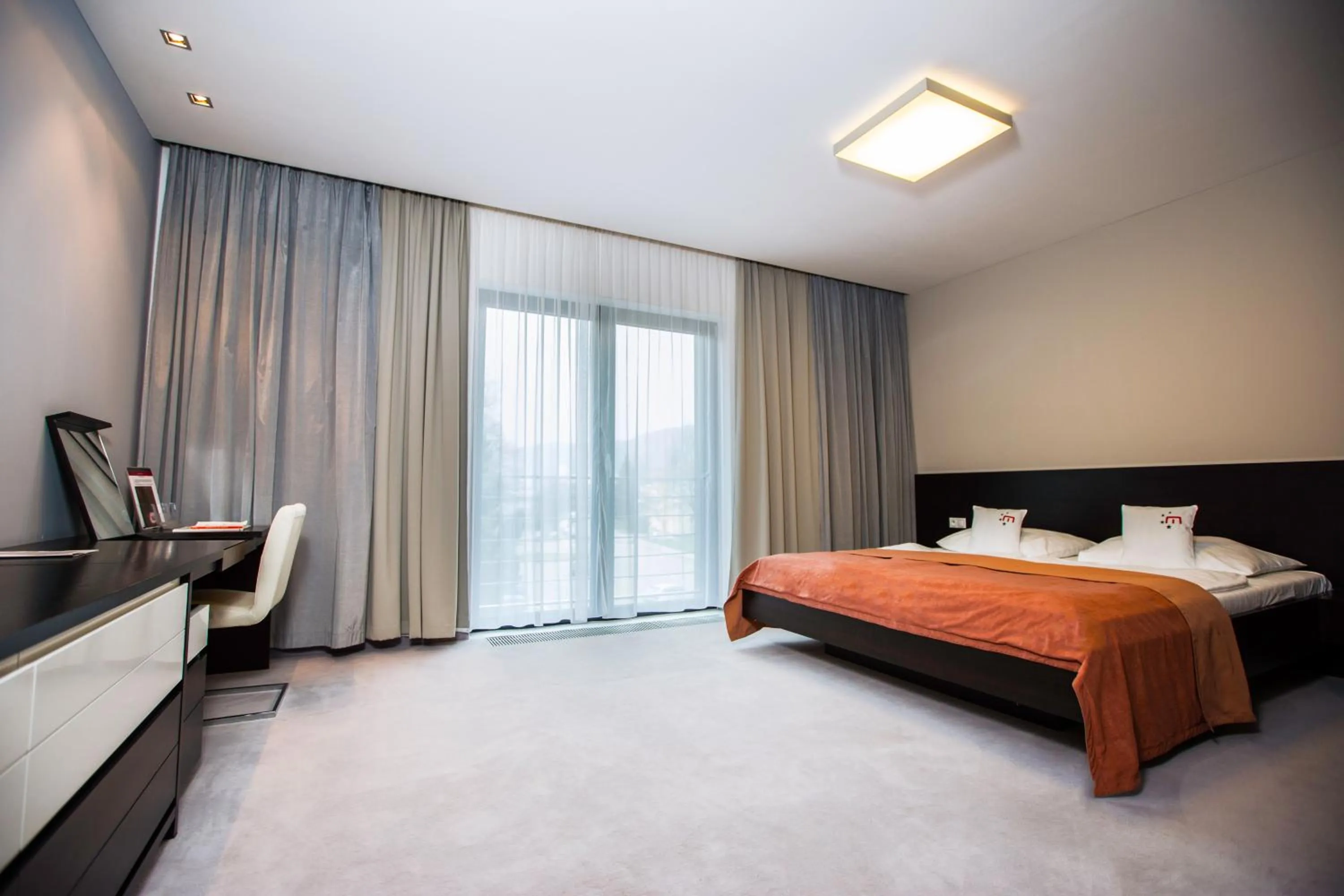 Seating area, Bed in Hotel Magnus Trenčín