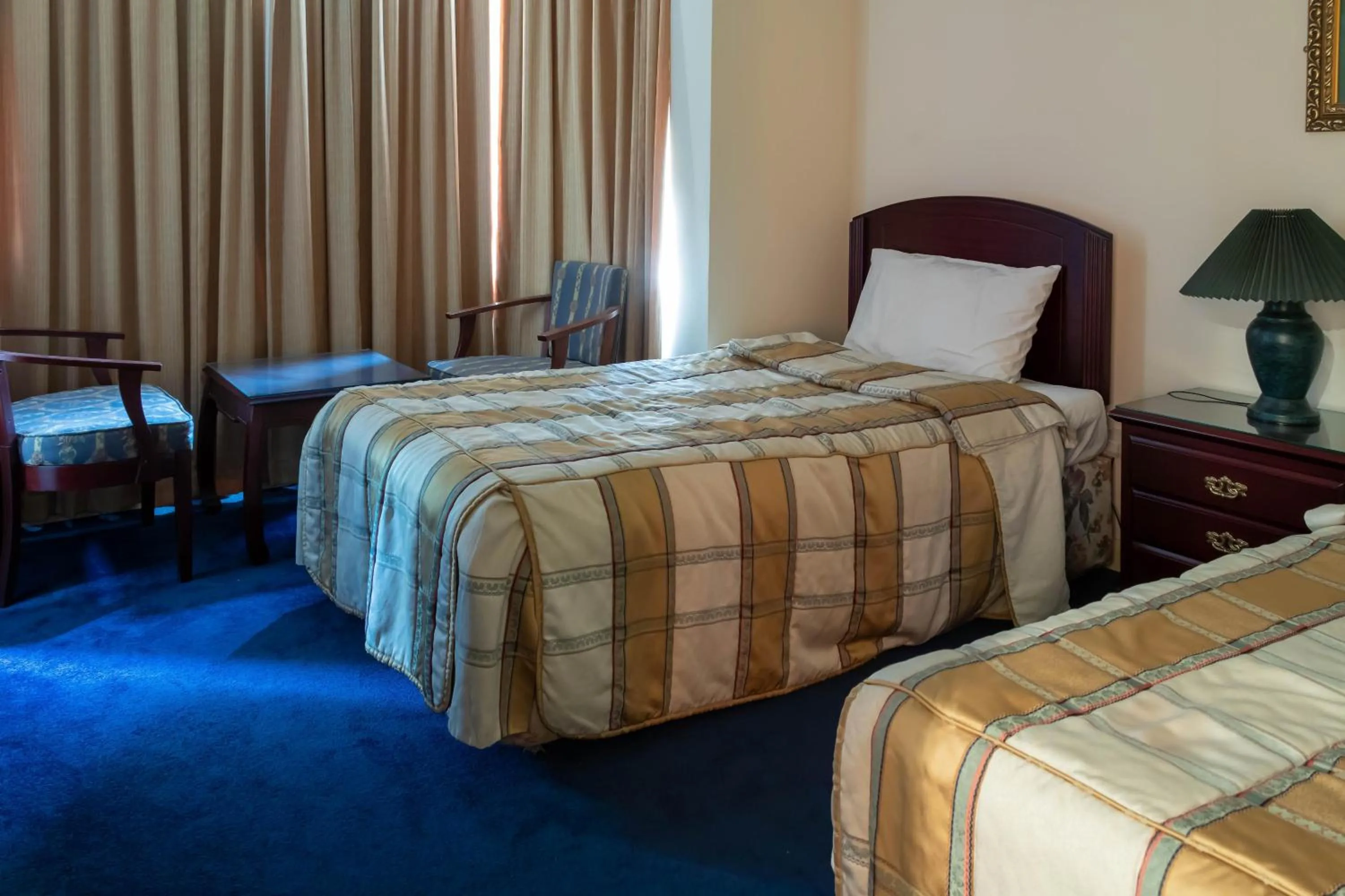 Bed in Mansouri Mansions Hotel