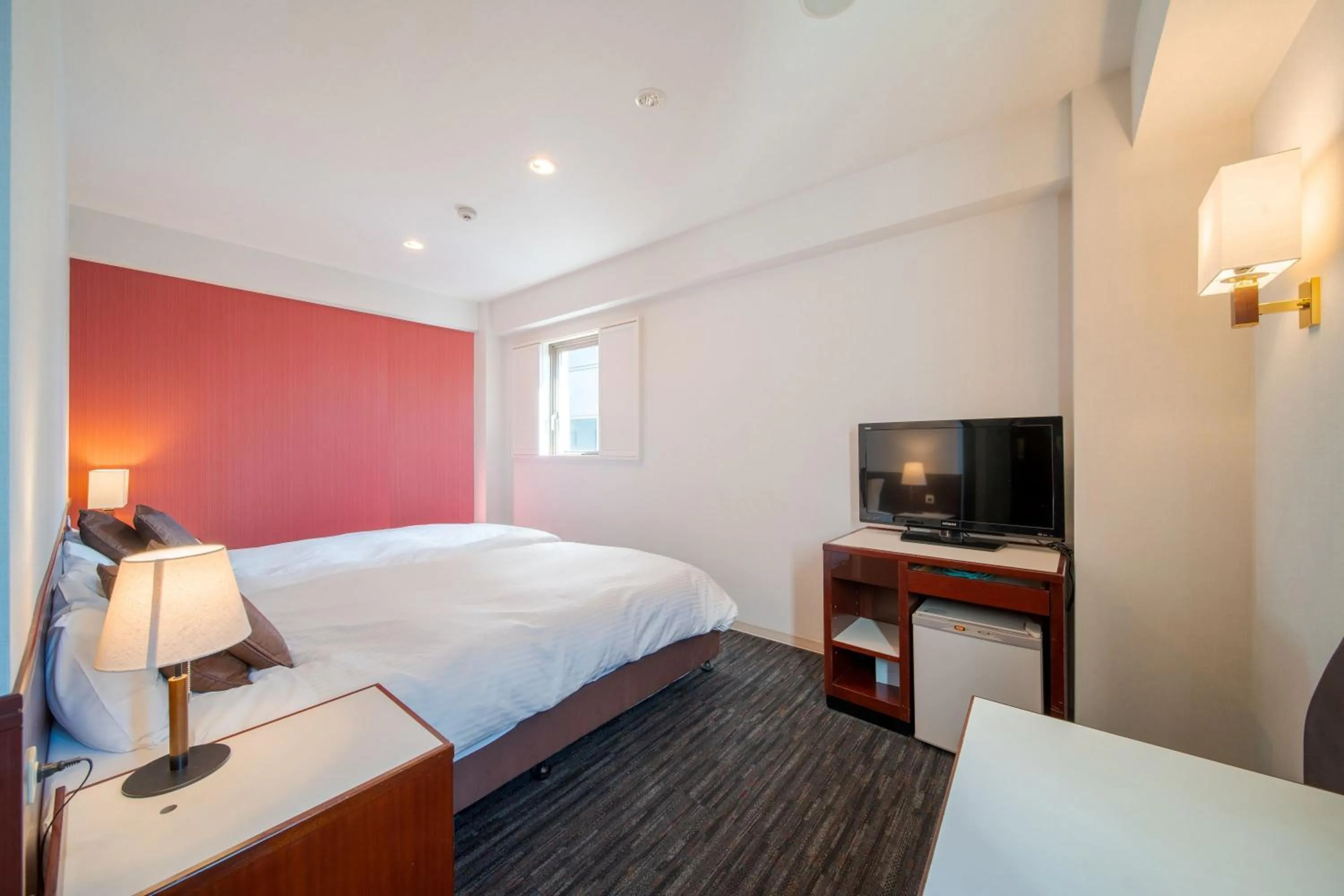 Bed in Meitetsu Inn Nagoya Ekimae