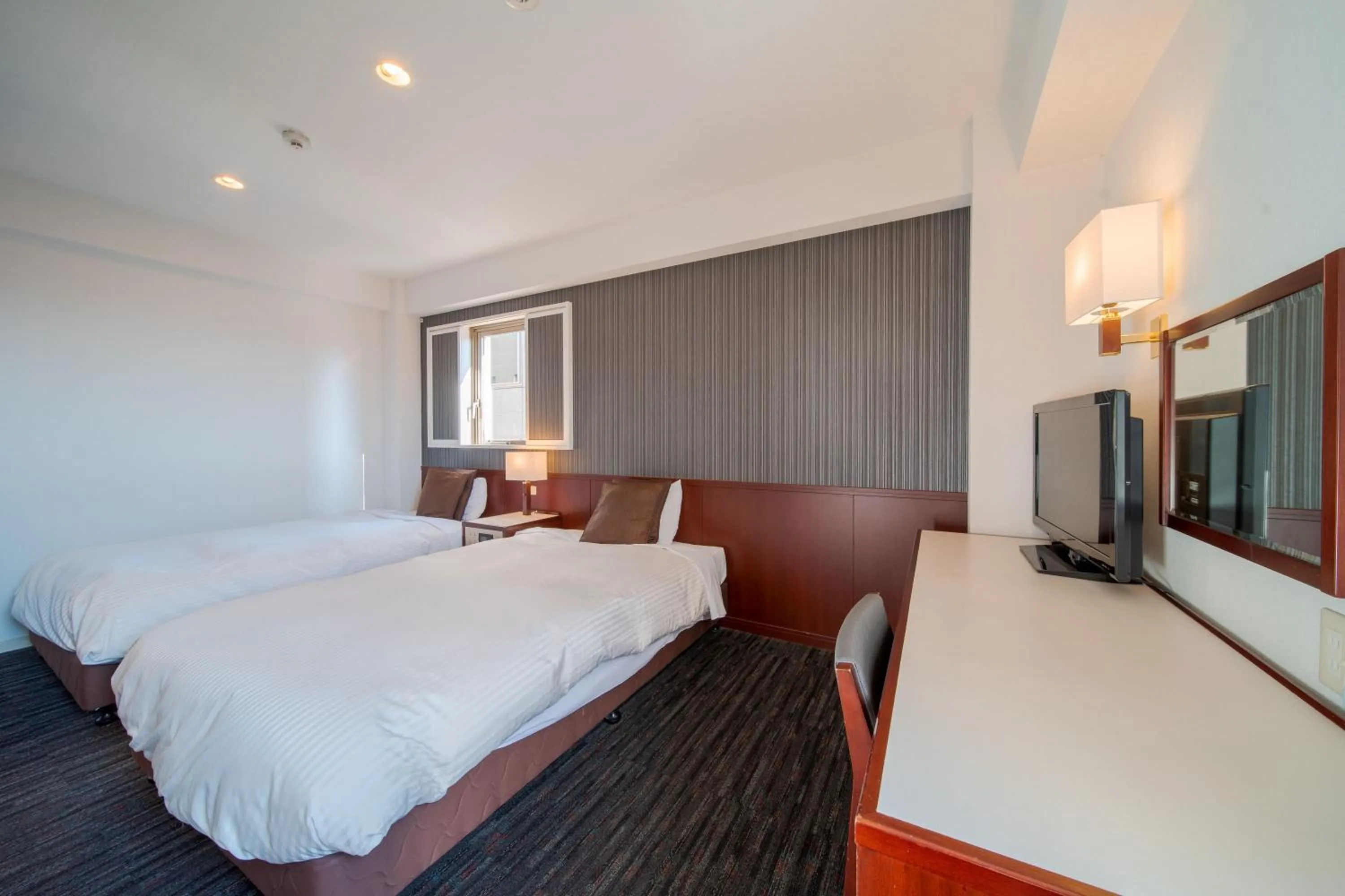 Communal lounge/ TV room, Bed in Meitetsu Inn Nagoya Ekimae