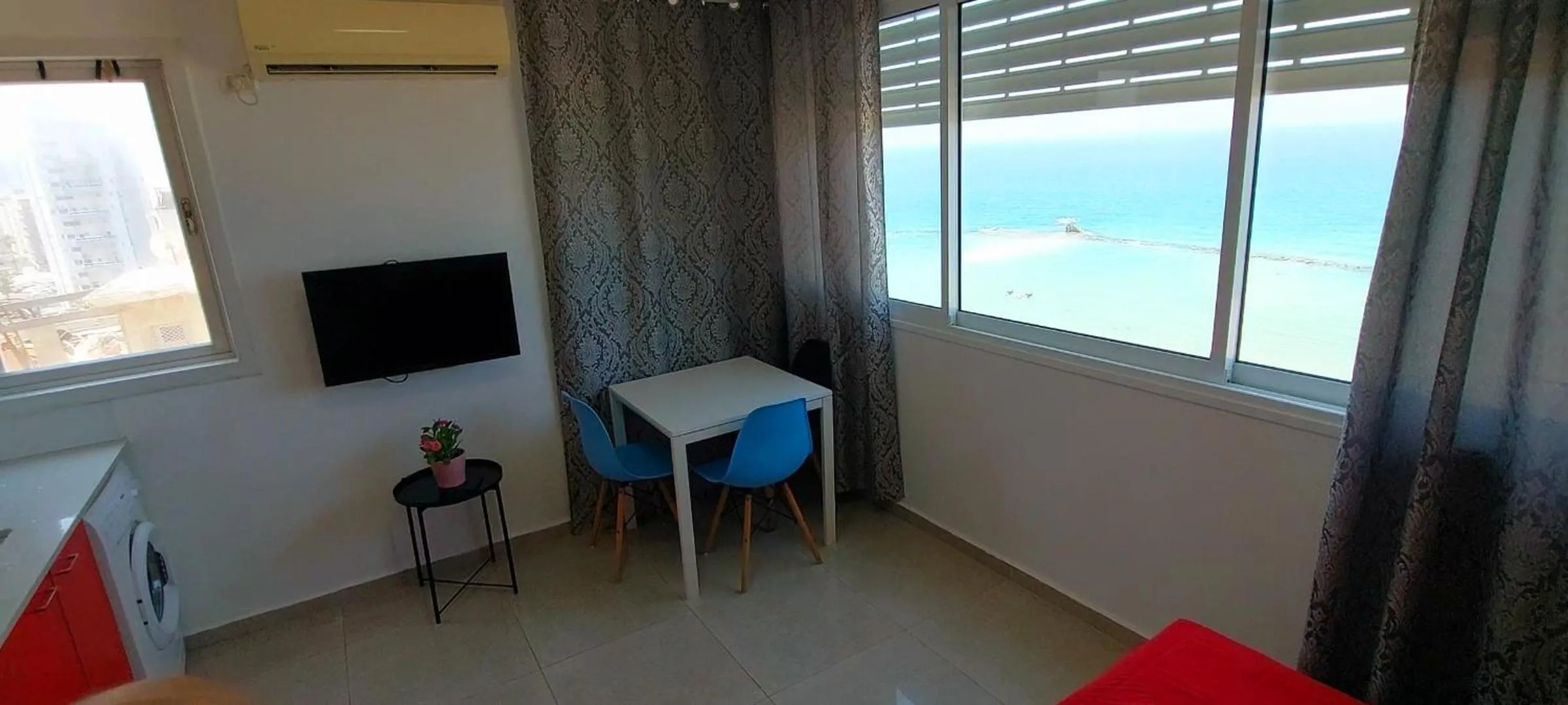 Seating area in 612 apartment on the beach