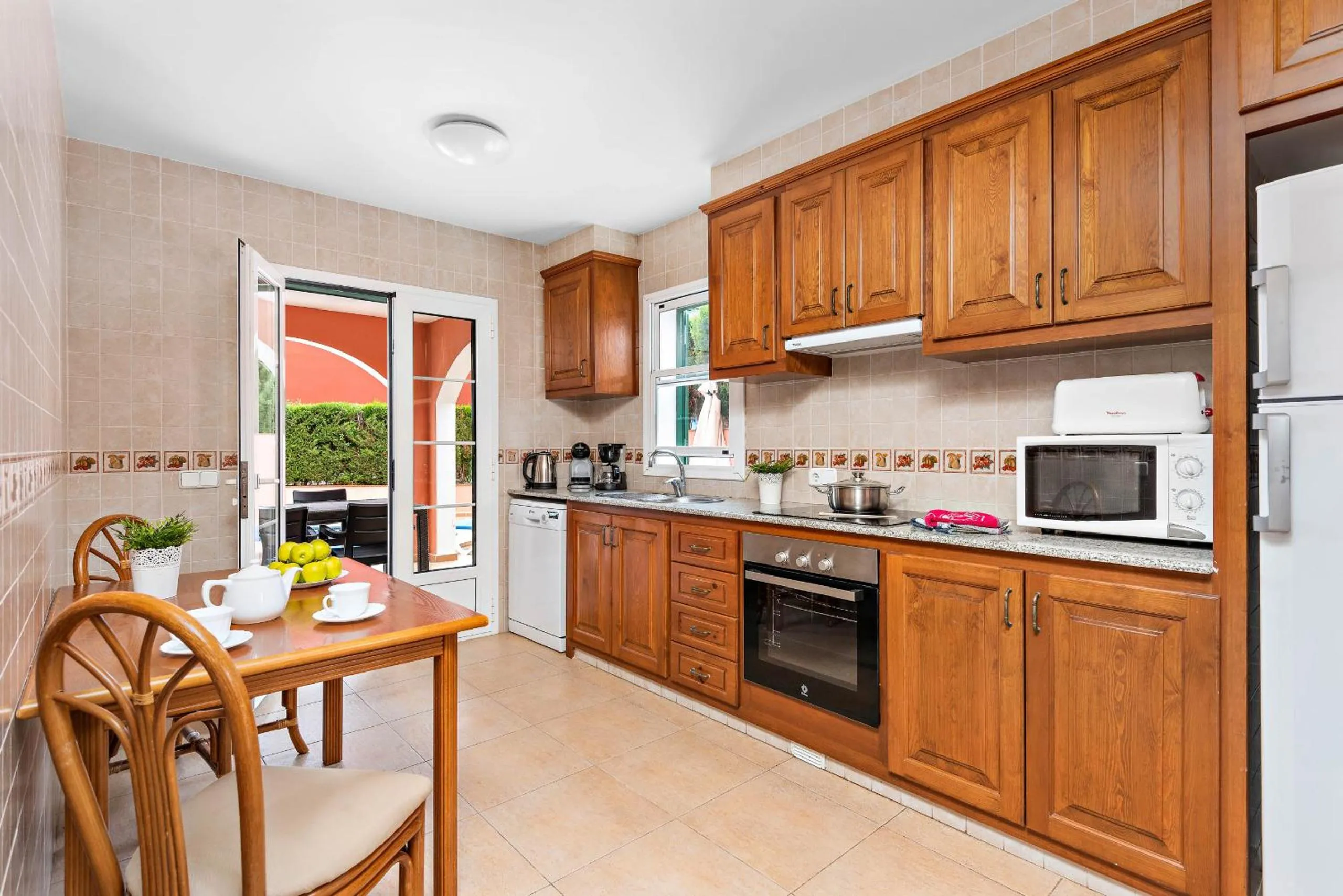 Kitchen or kitchenette in Villas Cala Galdana