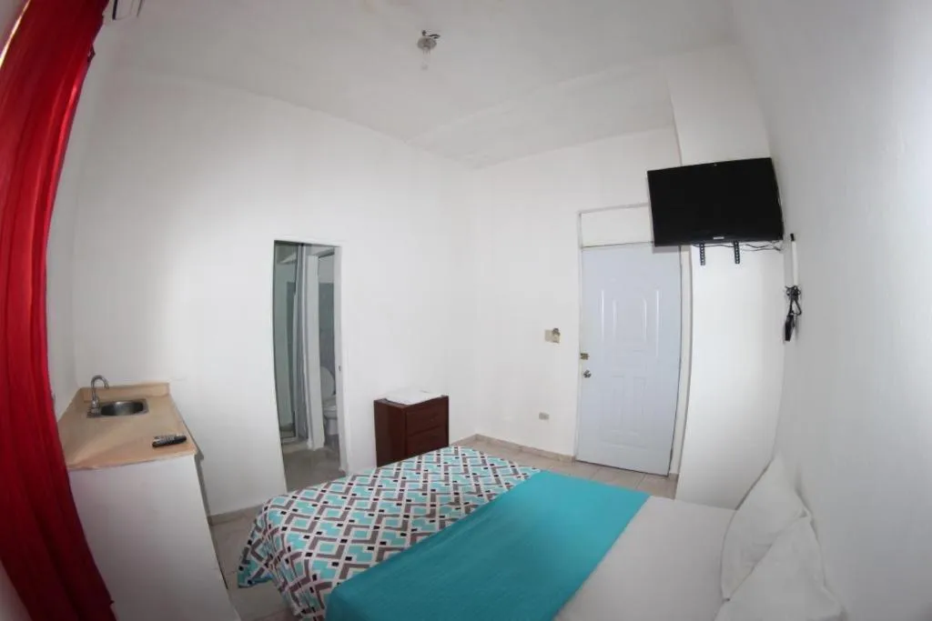 Bed in Caribbean Hotel Santo Domingo