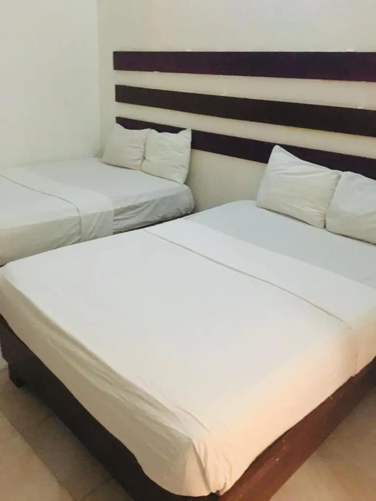 Bed in Caribbean Hotel Santo Domingo