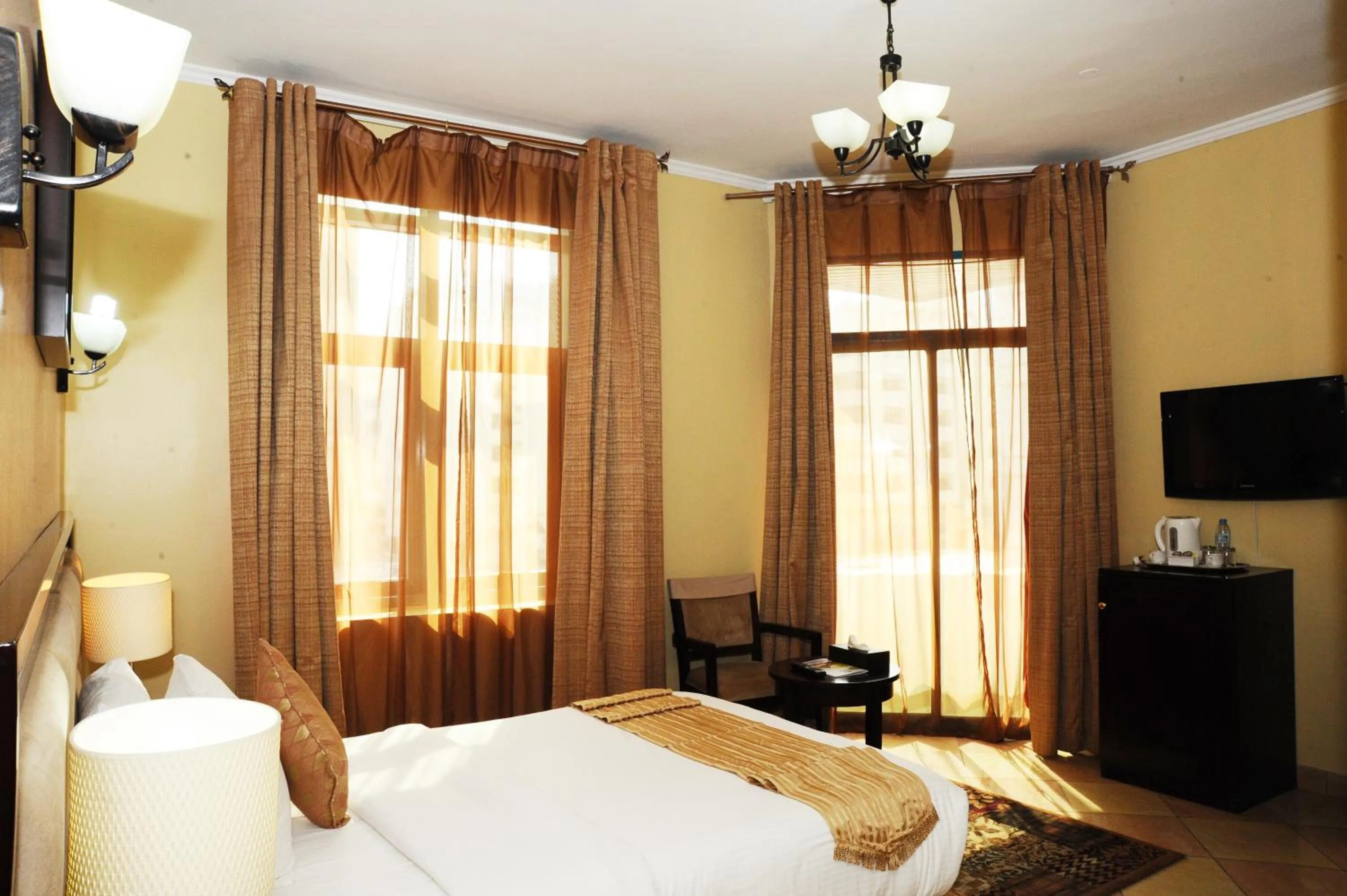 Bed in Al Jazeera Royal Hotel