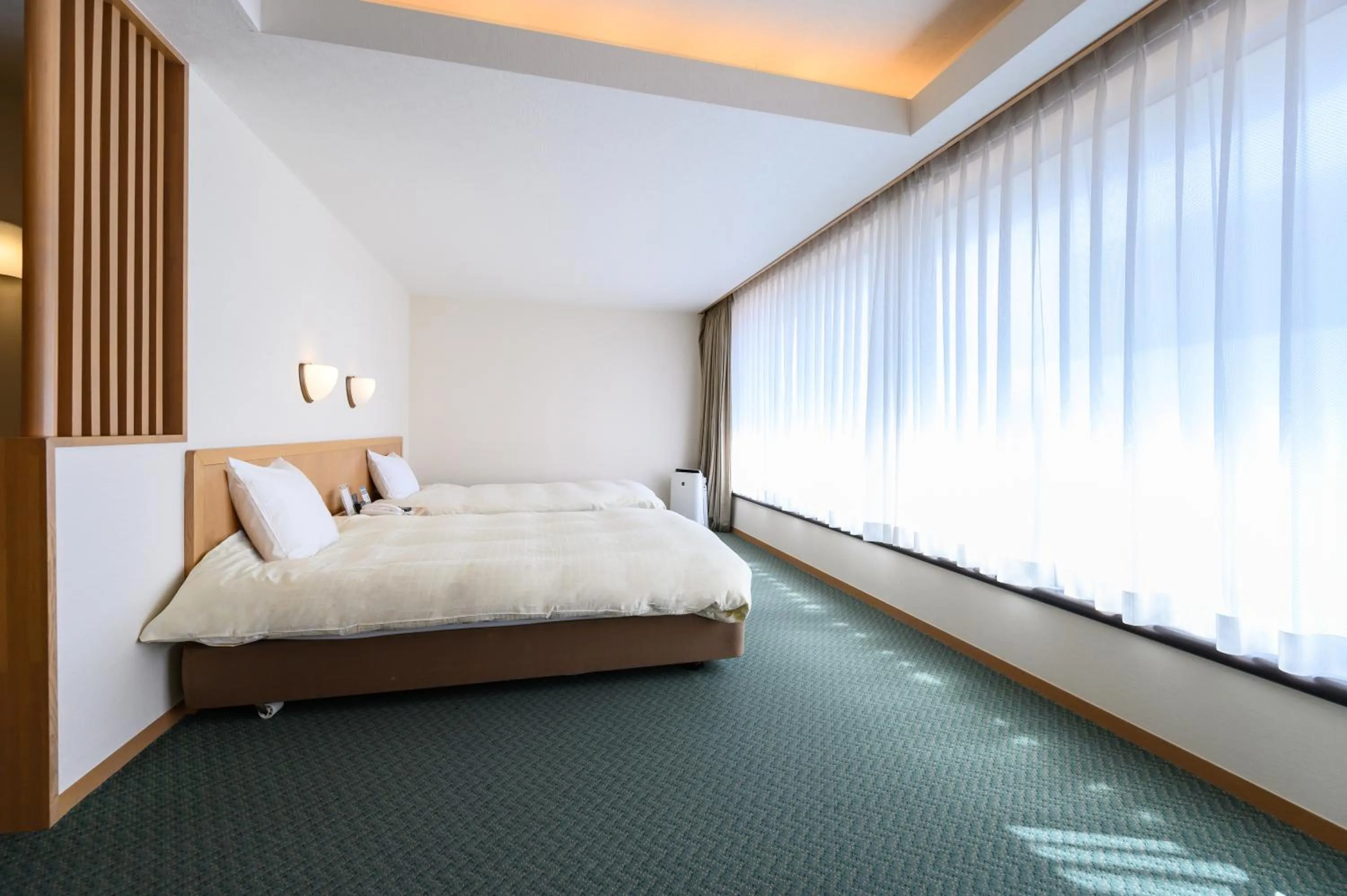 Bed in Nemu Resort Hotel Nemu