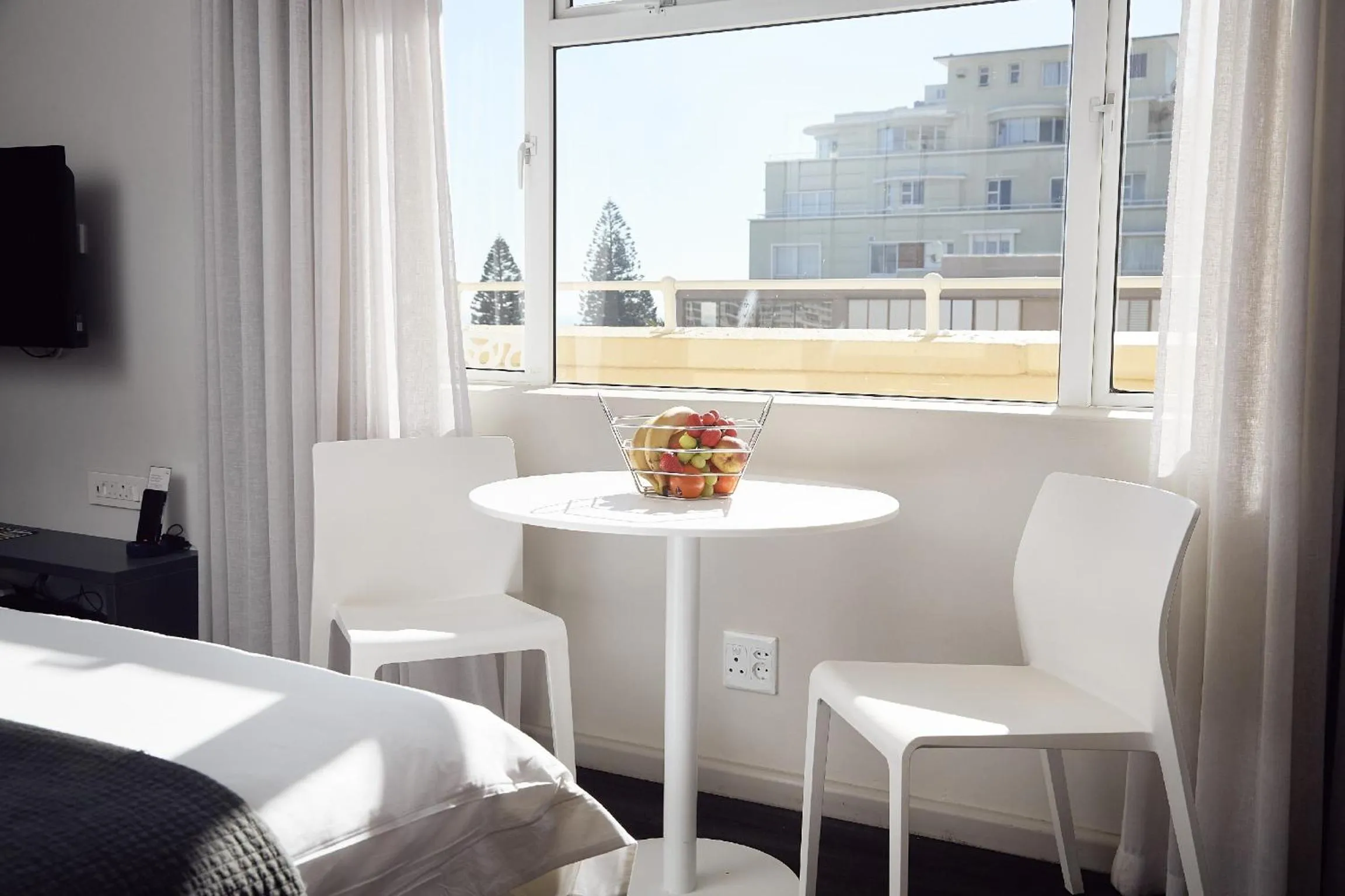 Seating area, Bed in First Group Riviera Suites