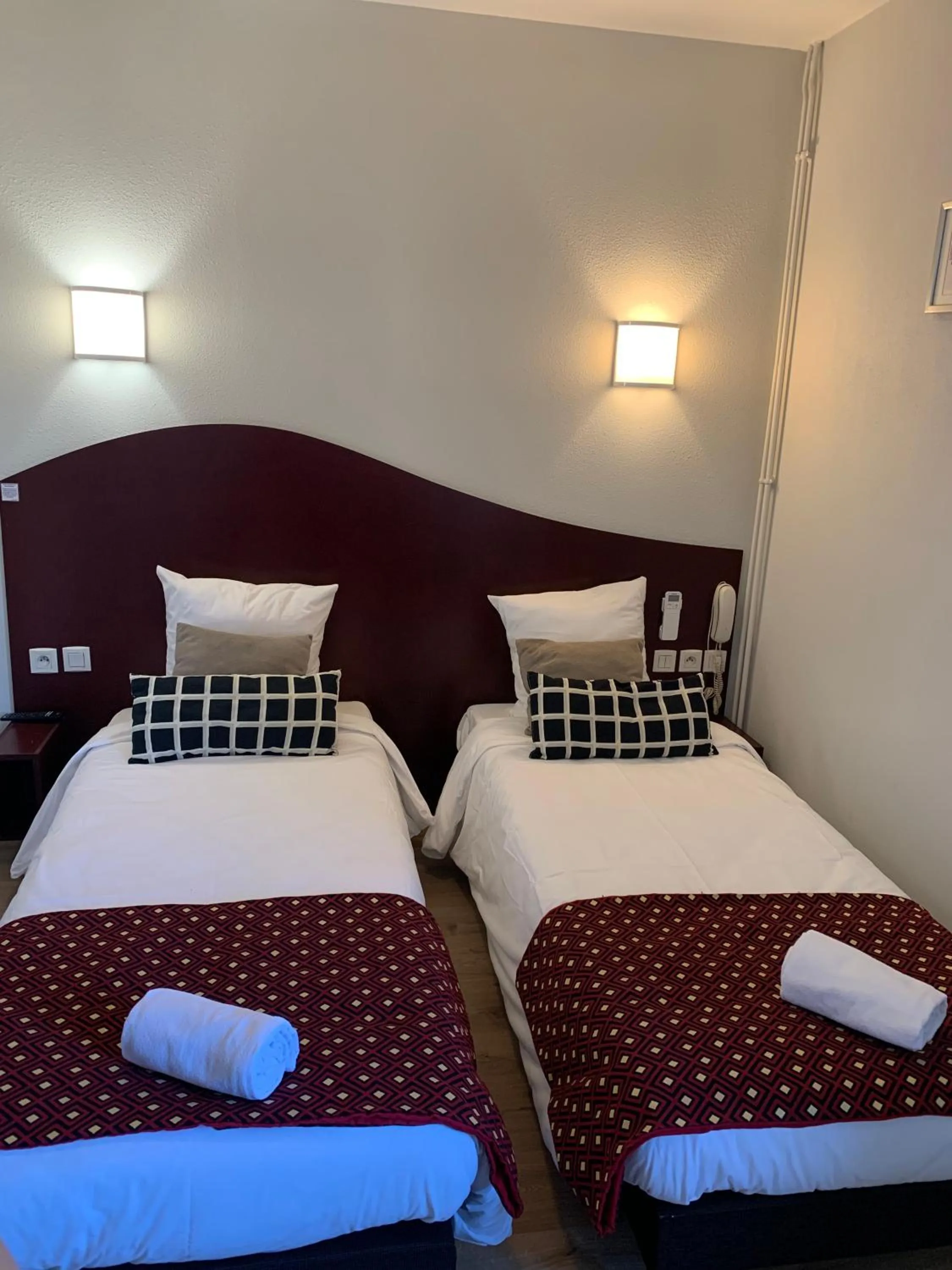 Bed in Hotel les Commercants