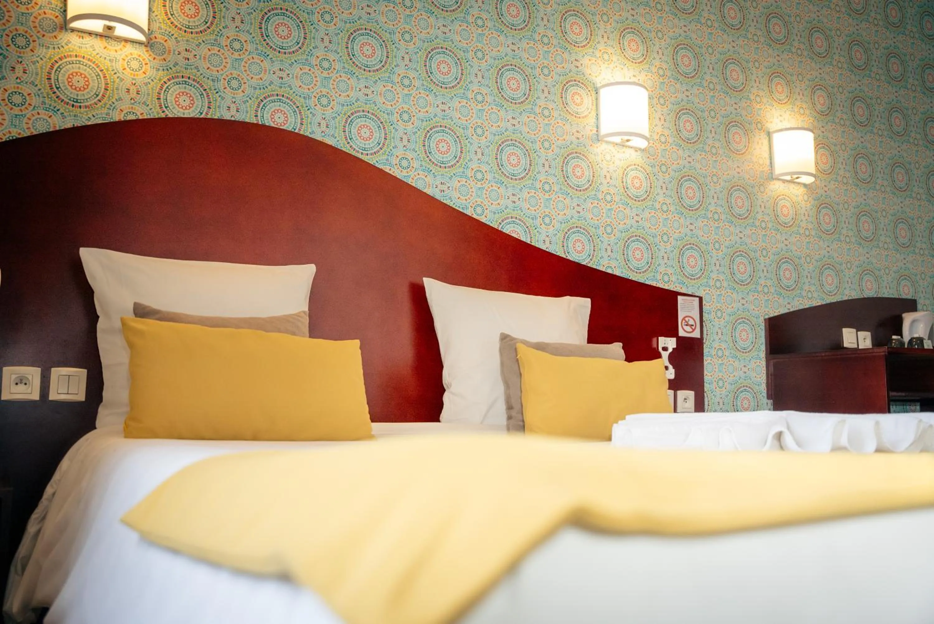 Bed in Hotel les Commercants