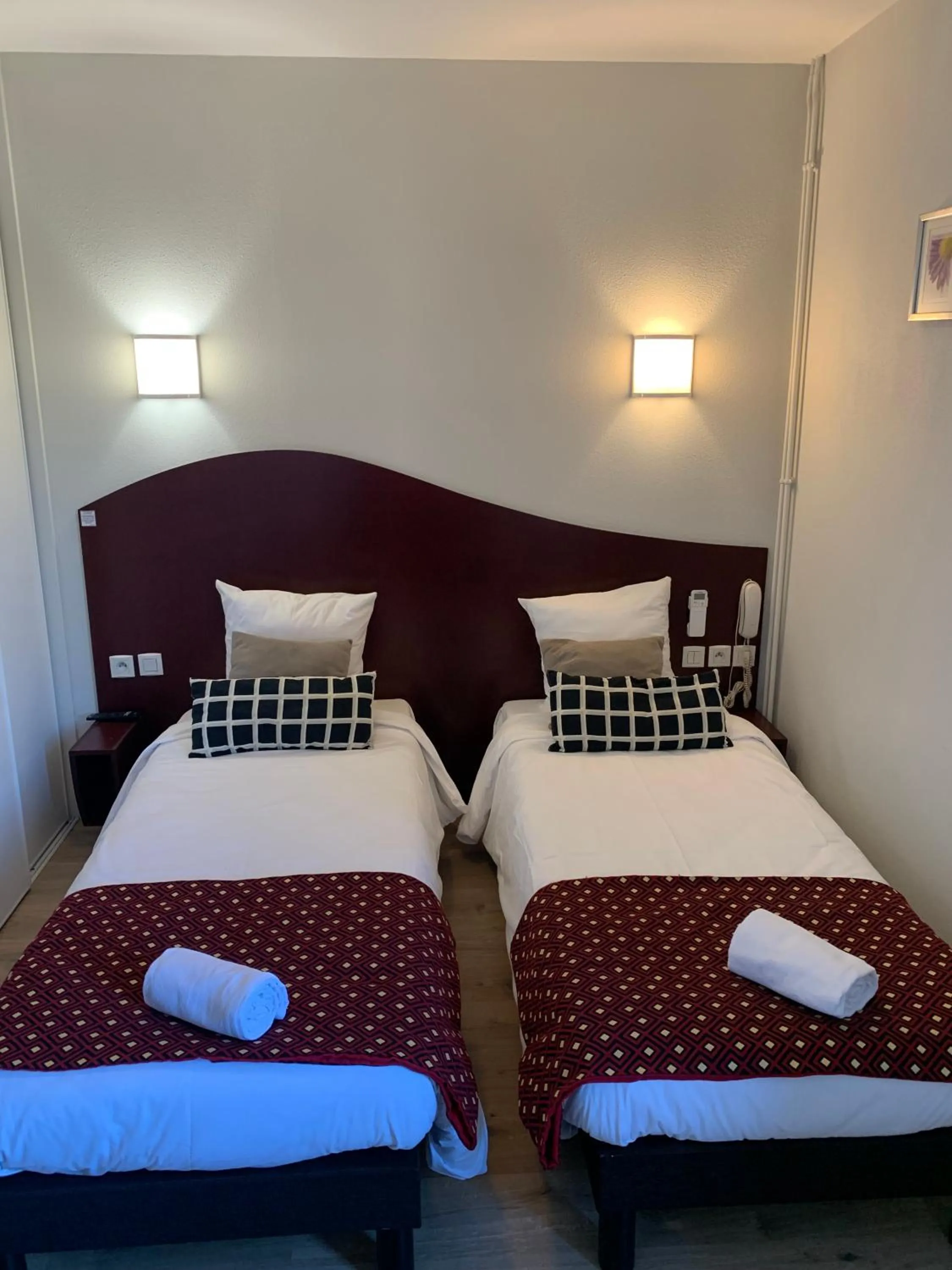 Bed in Hotel les Commercants