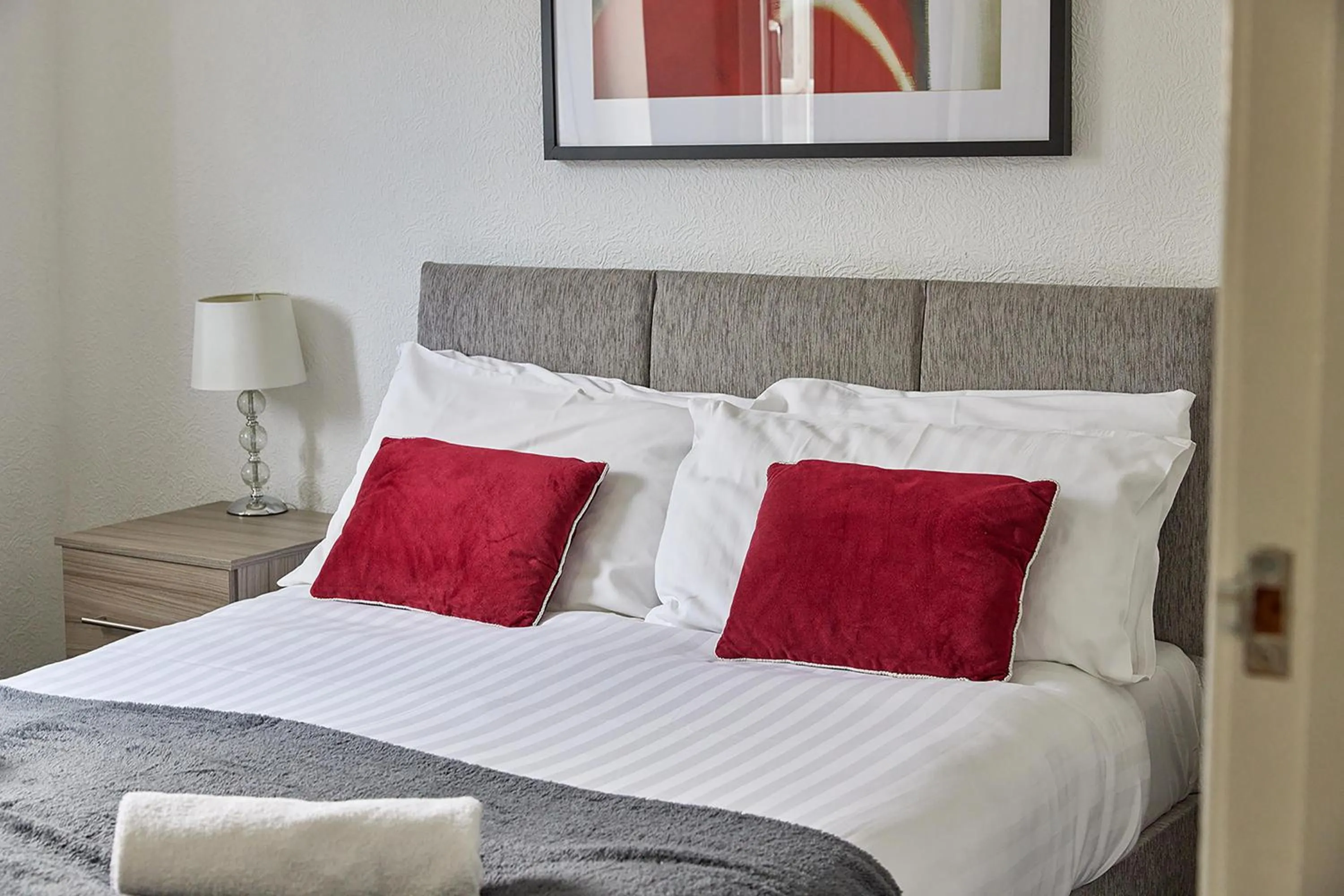 Bed in Pleasure Holiday Apartments