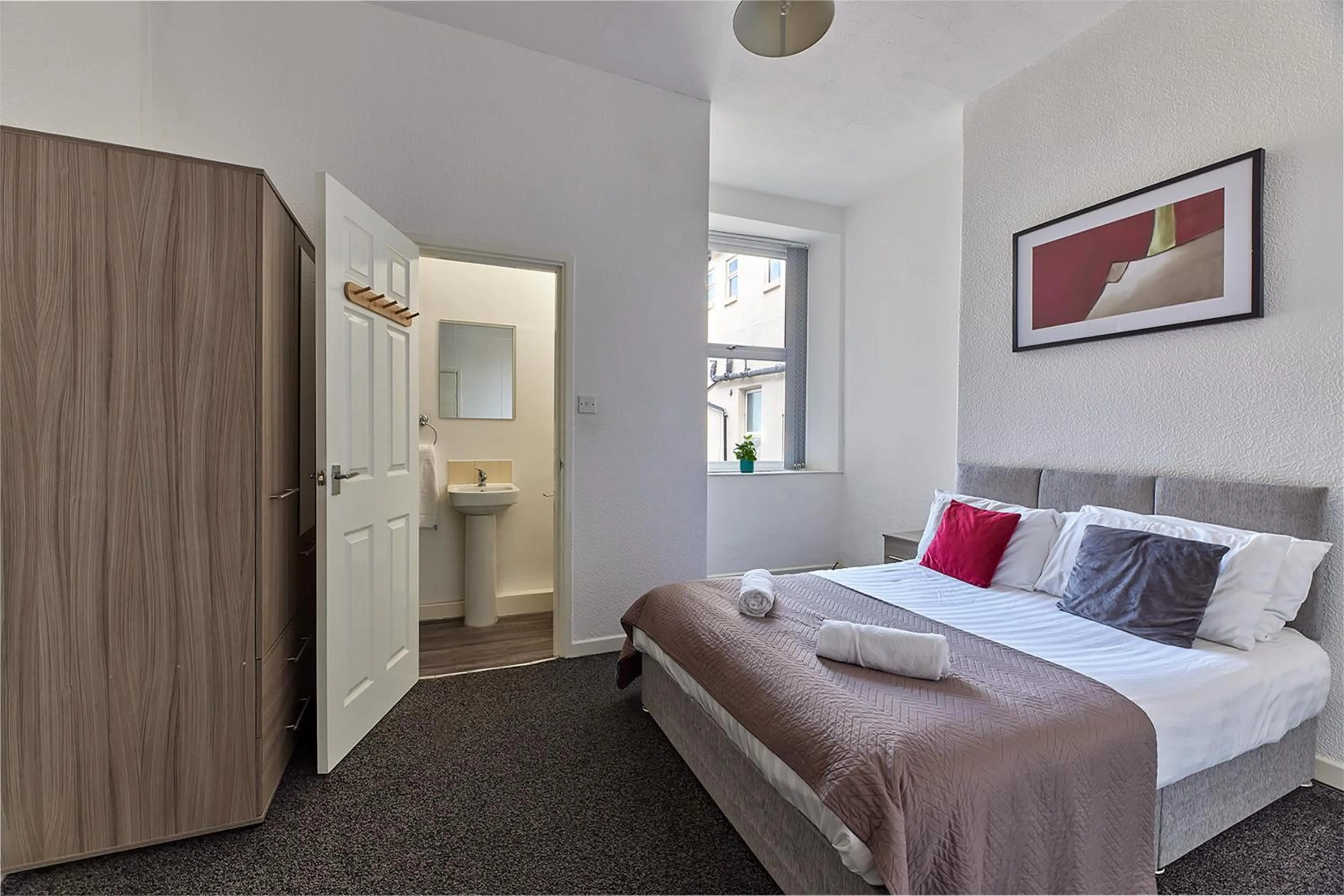 Bed in Pleasure Holiday Apartments