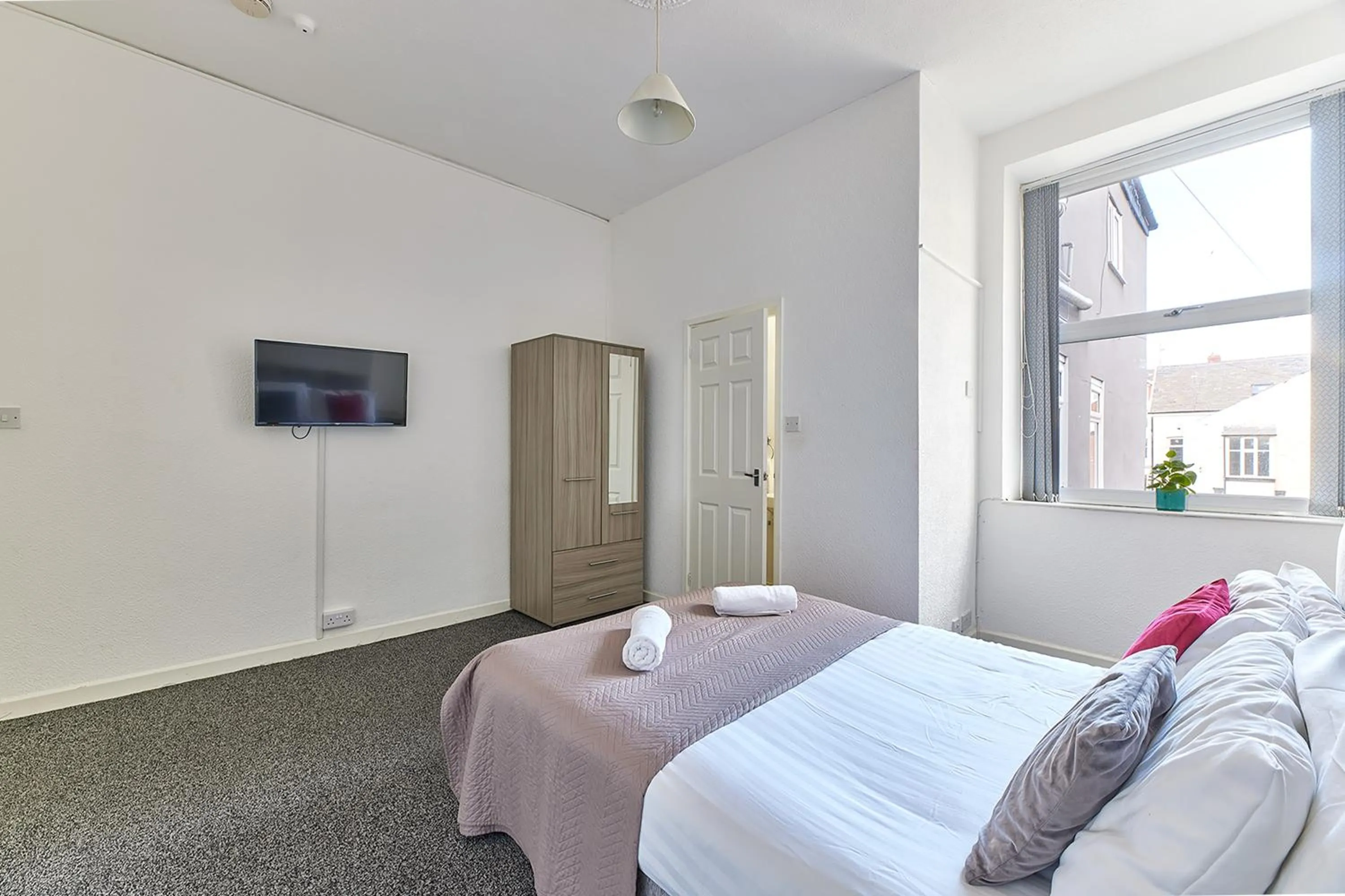 Bed in Pleasure Holiday Apartments