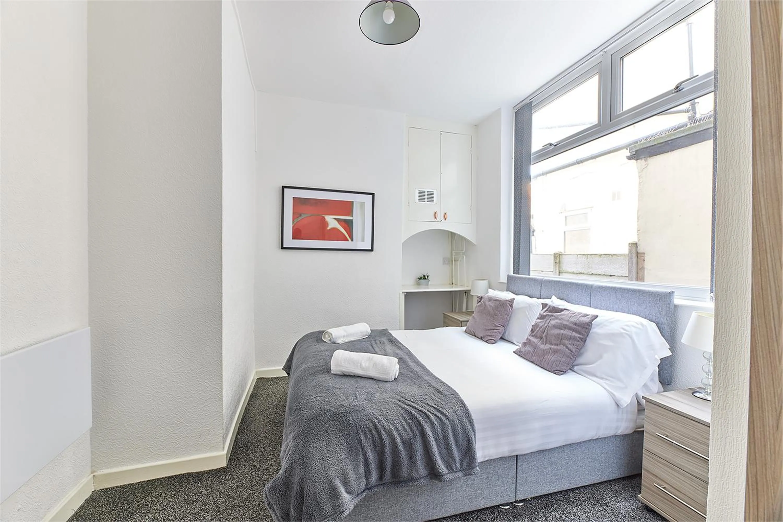 Bed in Pleasure Holiday Apartments